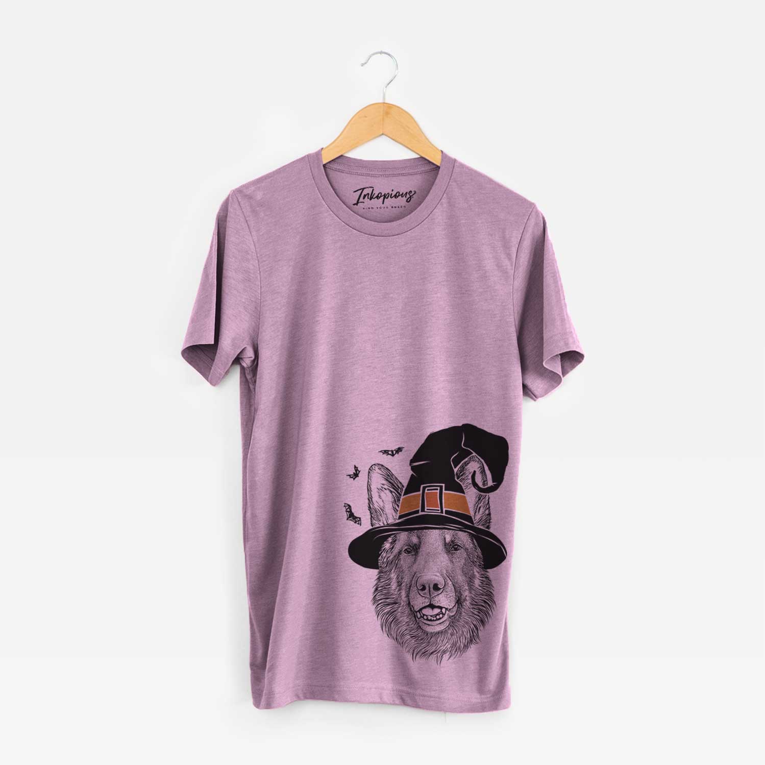 Hand-drawn sketch of Sammie the German Shepherd wearing a witch hat on an Orchid Unisex crewneck