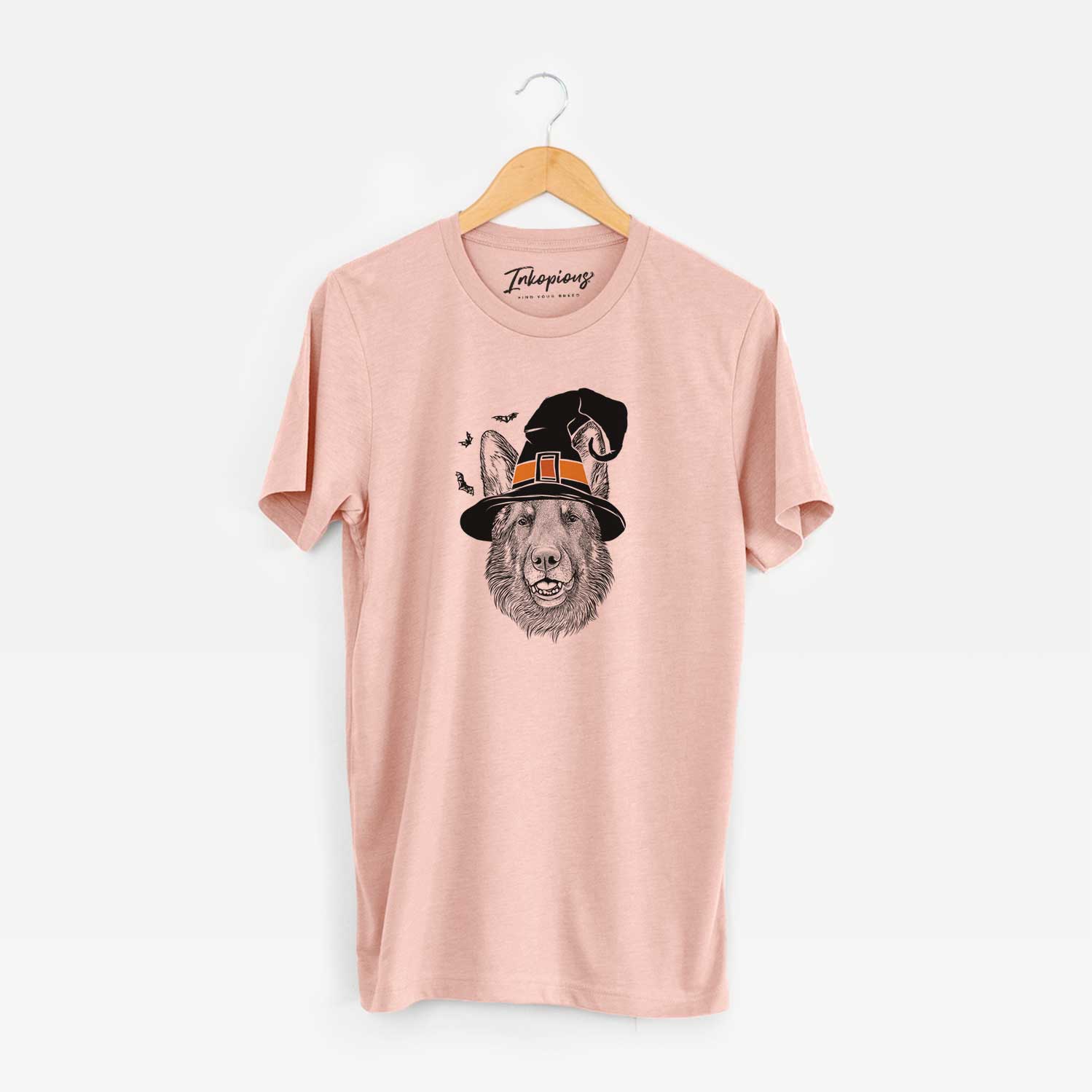 Hand-drawn sketch of Sammie the German Shepherd wearing a witch hat on a Peach Unisex crewneck