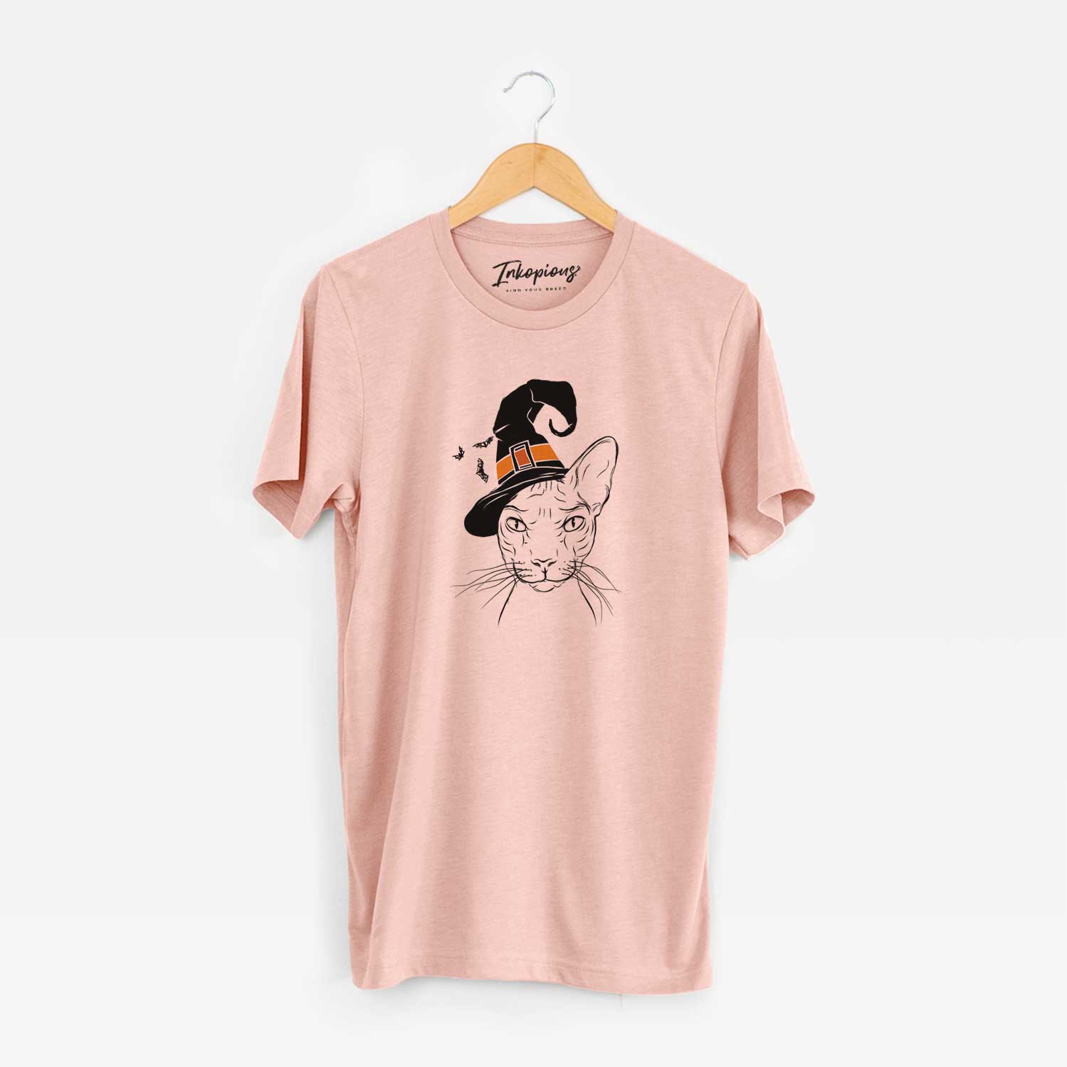 Hand-drawn sketch of Sammy the Spinx Cat wearing a witch hat on a Peach Unisex crewneck
