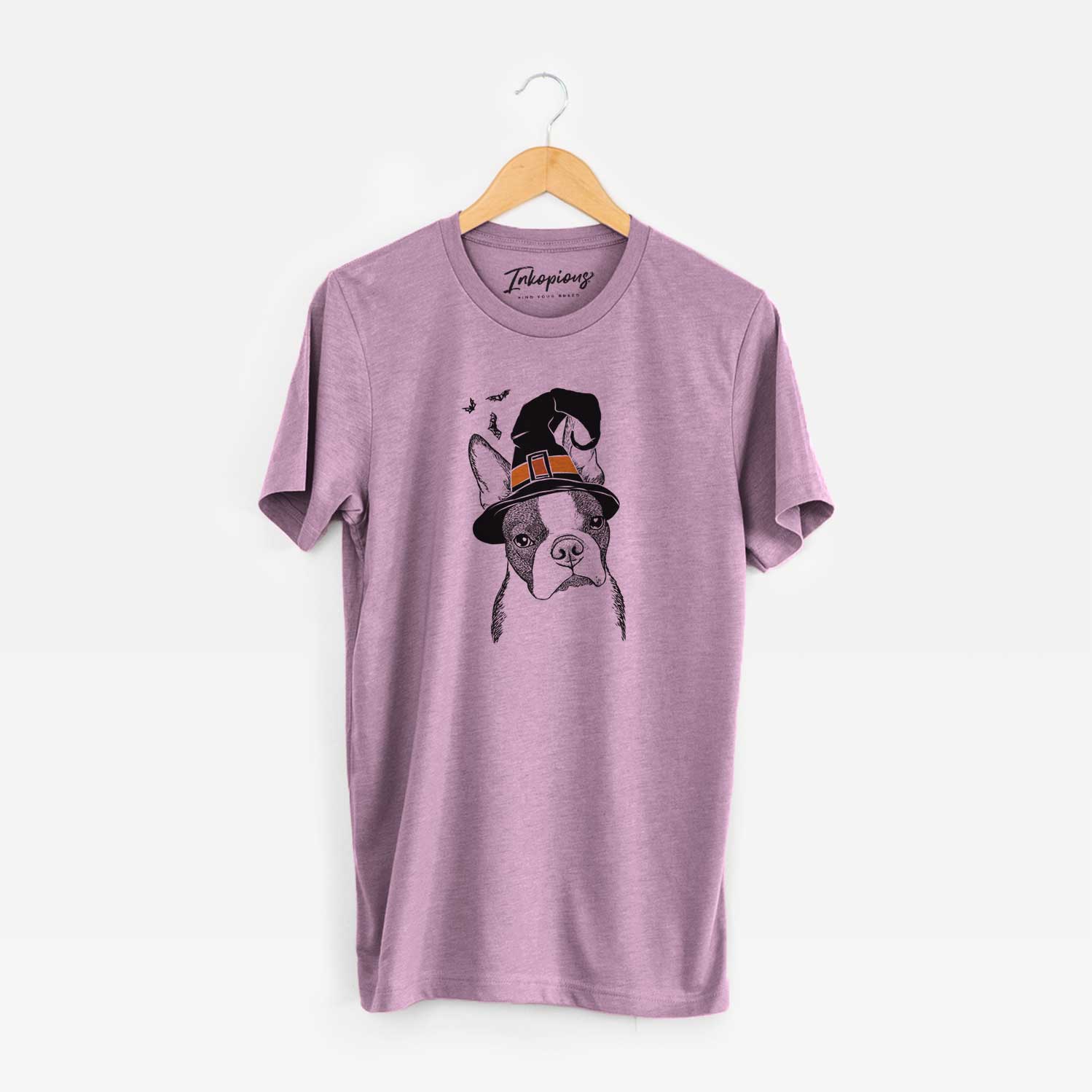 Hand-drawn sketch of Samuel the Boston Terrier wearing a witch hat on an Orchid Unisex crewneck