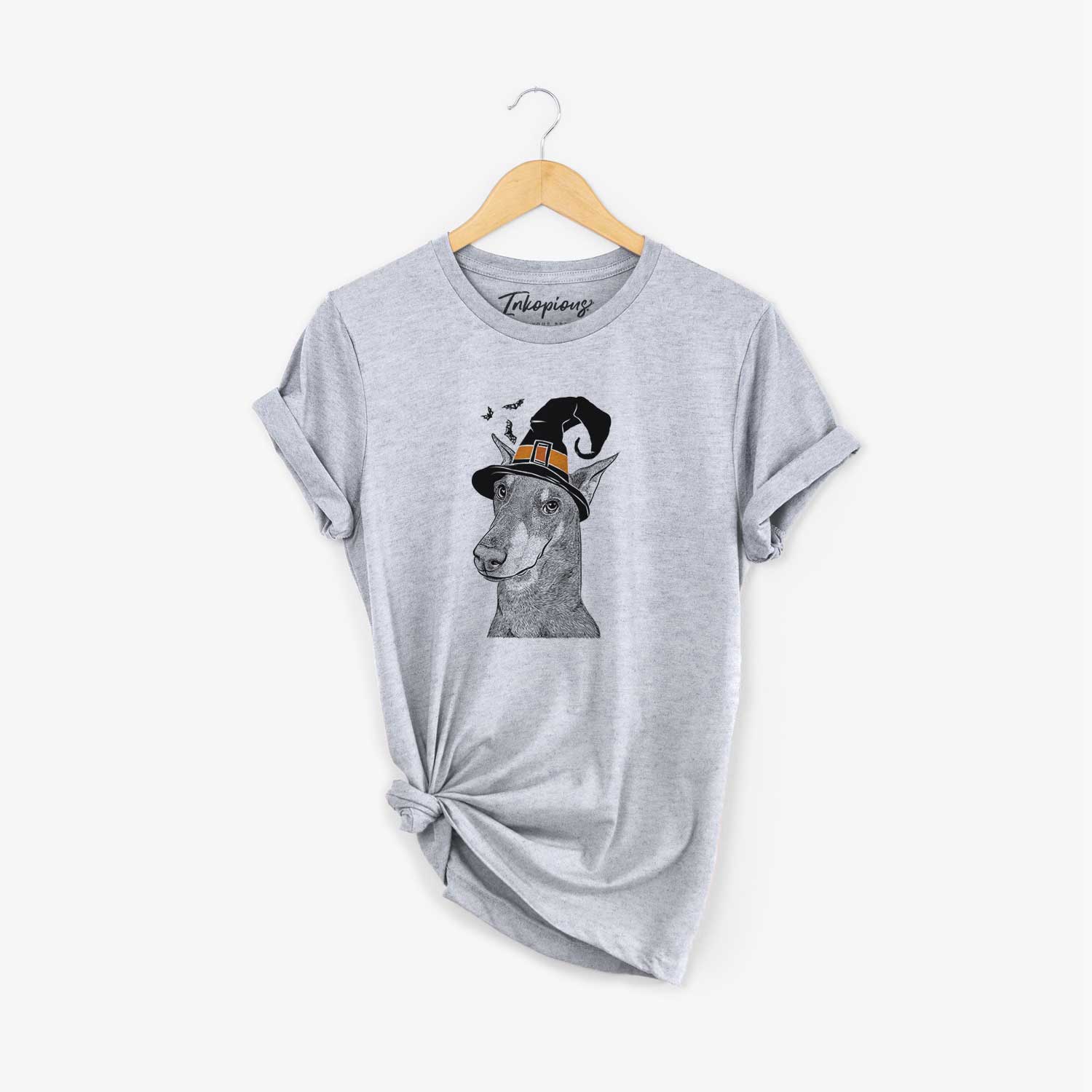 Hand-drawn sketch of Shelby the Doberman Pinscher wearing a witch hat on a Grey Unisex crewneck