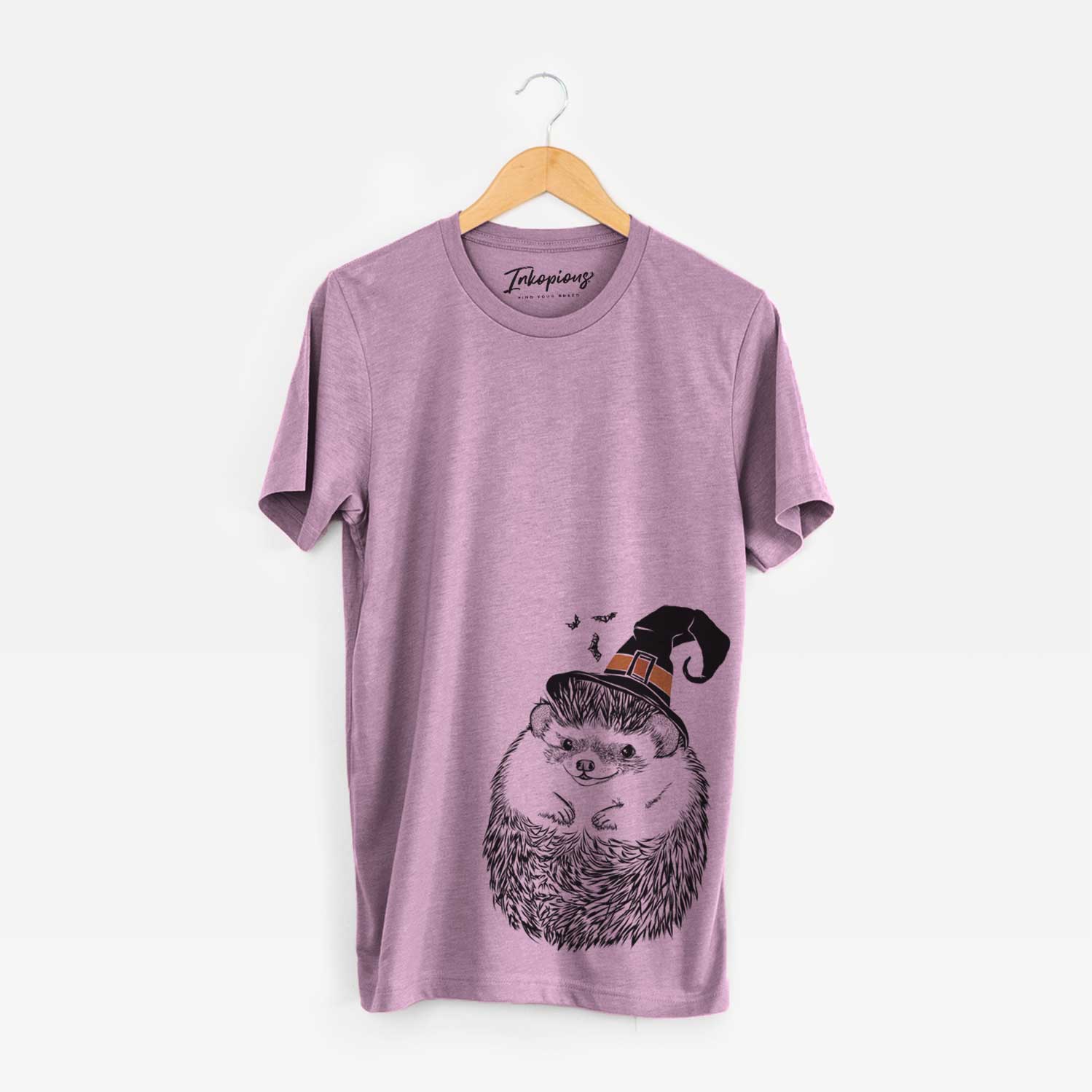 Hand-drawn sketch of Sid the Hedgehog wearing a witch hat on an Orchid Unisex crewneck