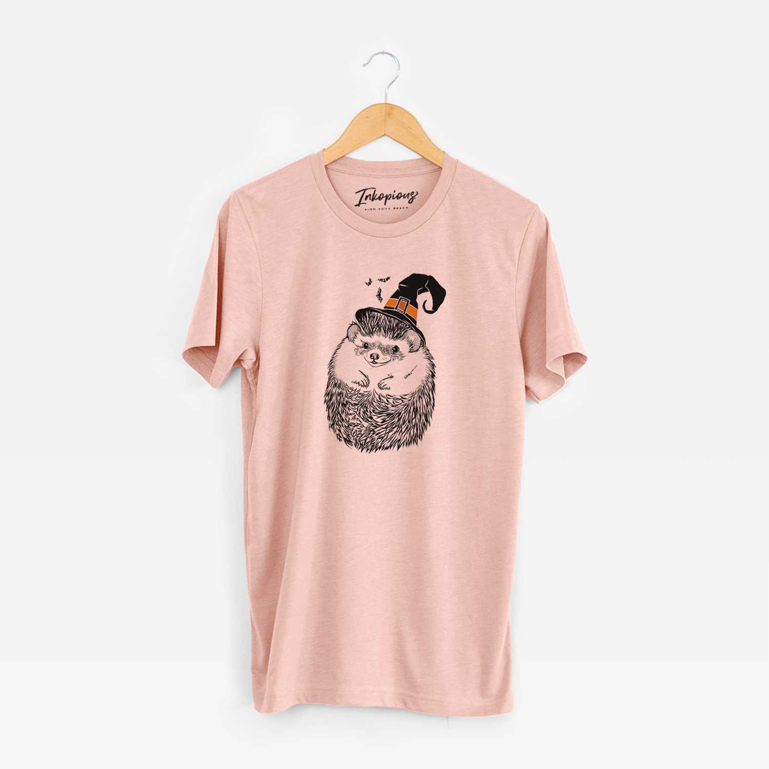 Hand-drawn sketch of Sid the Hedgehog wearing a witch hat on a Peach Unisex crewneck
