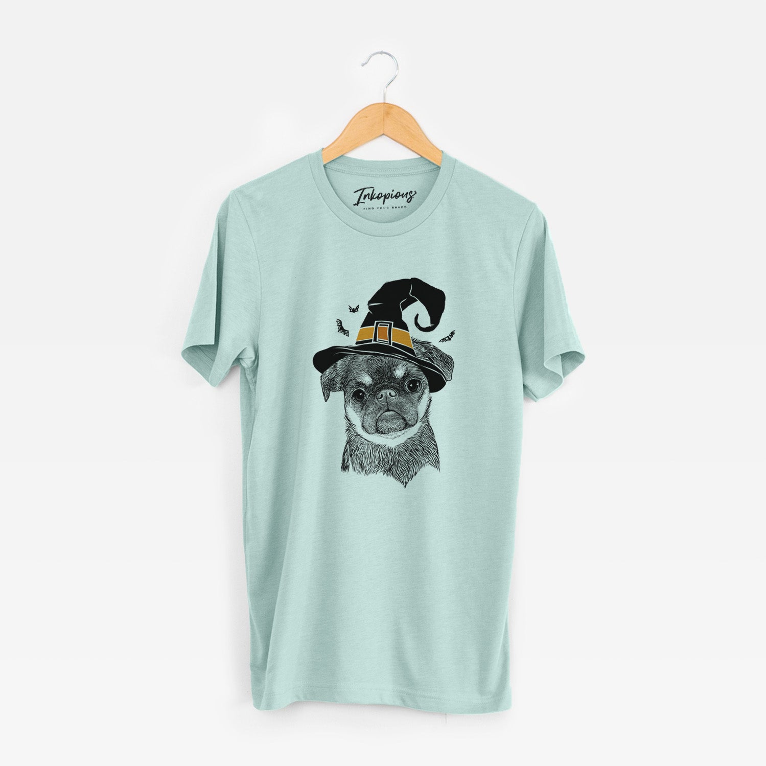 Hand-drawn sketch of Simone the Brussels Griffon wearing a witch hat on a Heather Sage Unisex crewneck