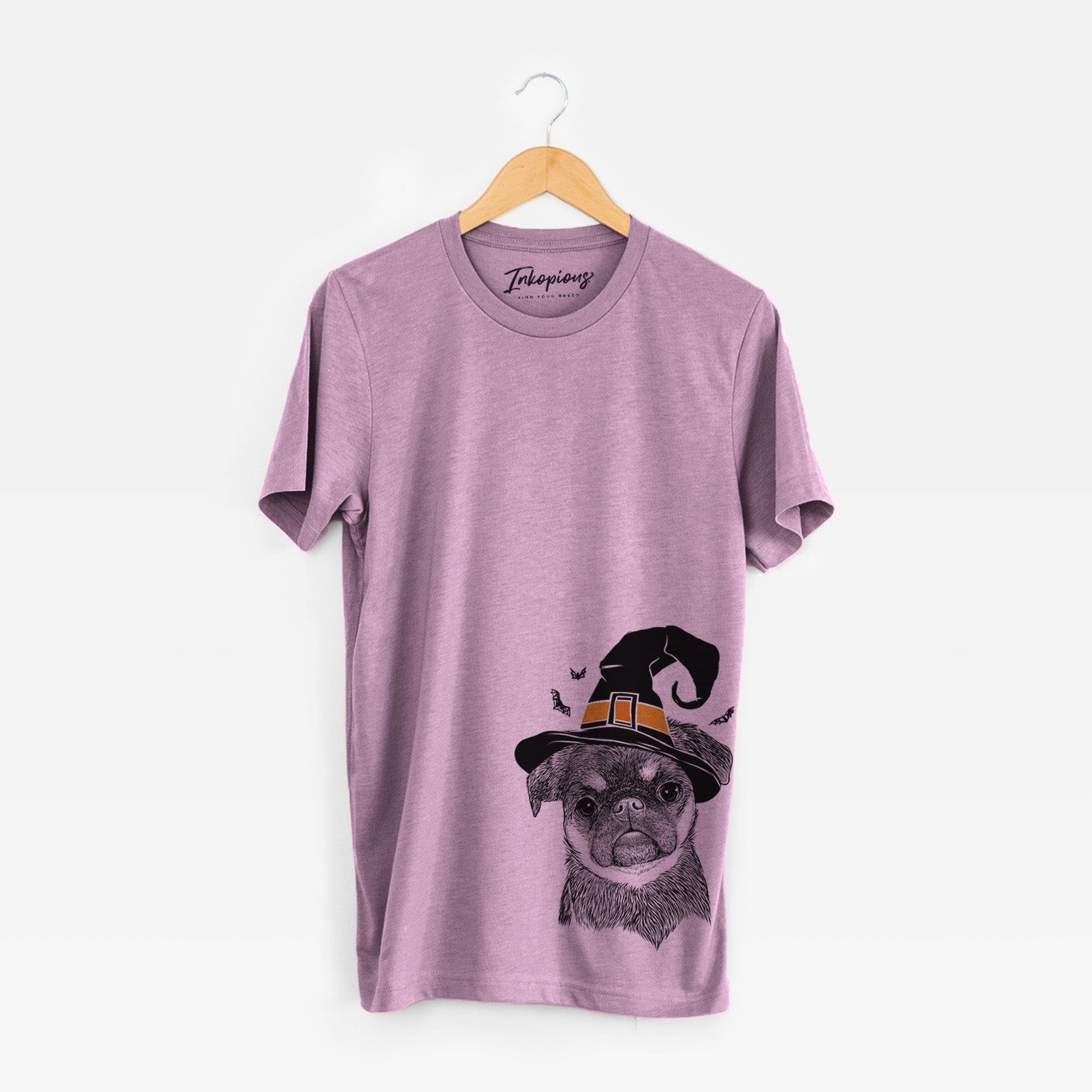 Hand-drawn sketch of Simone the Brussels Griffon wearing a witch hat on an Orchid Unisex crewneck