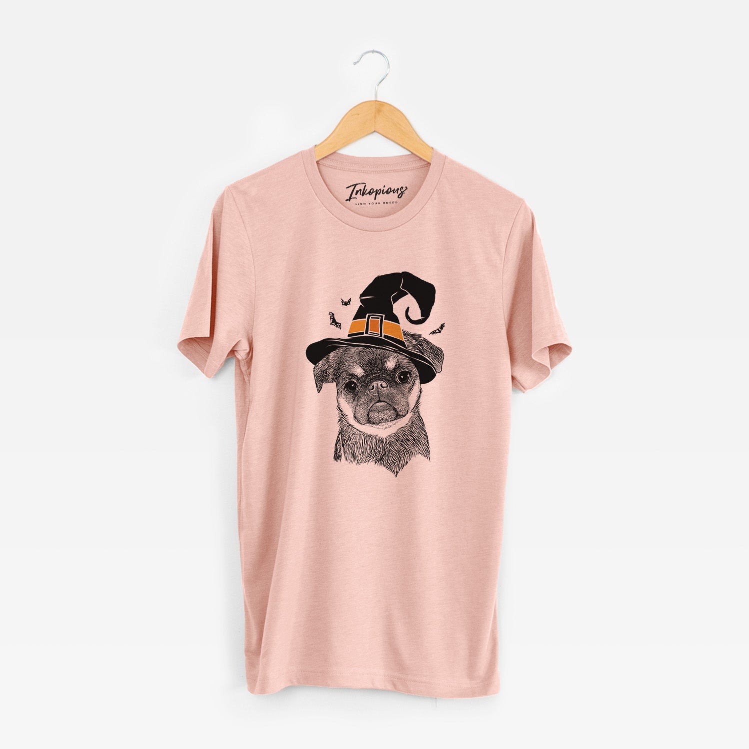 Hand-drawn sketch of Simone the Brussels Griffon wearing a witch hat on a Peach Unisex crewneck