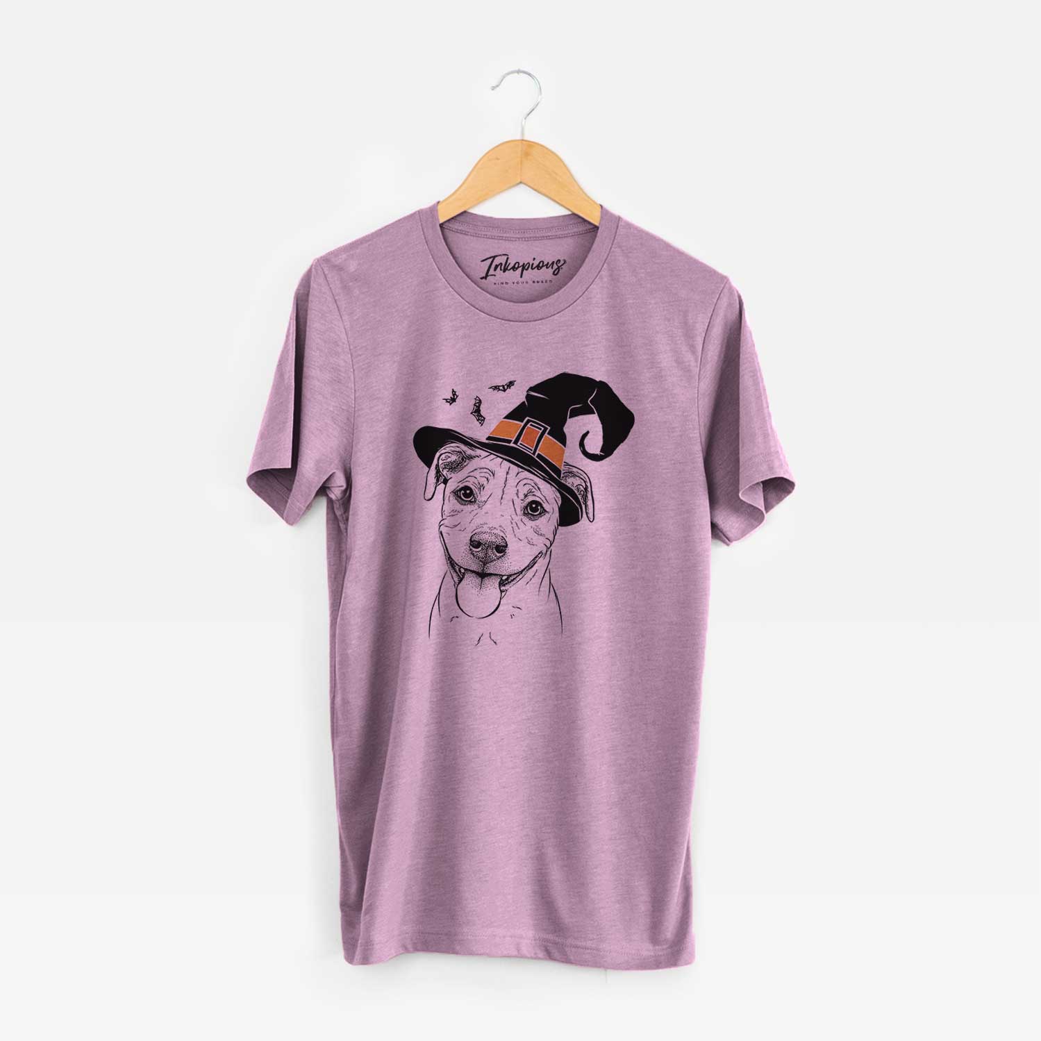 Hand-drawn sketch of Skye the Pitweiler wearing a witch hat on an Orchid Unisex crewneck