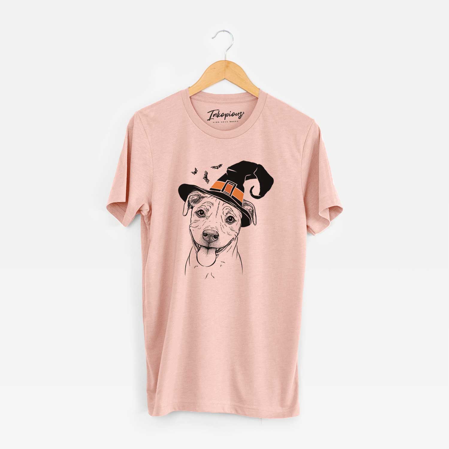 Hand-drawn sketch of Skye the Pitweiler wearing a witch hat on a Peach Unisex crewneck