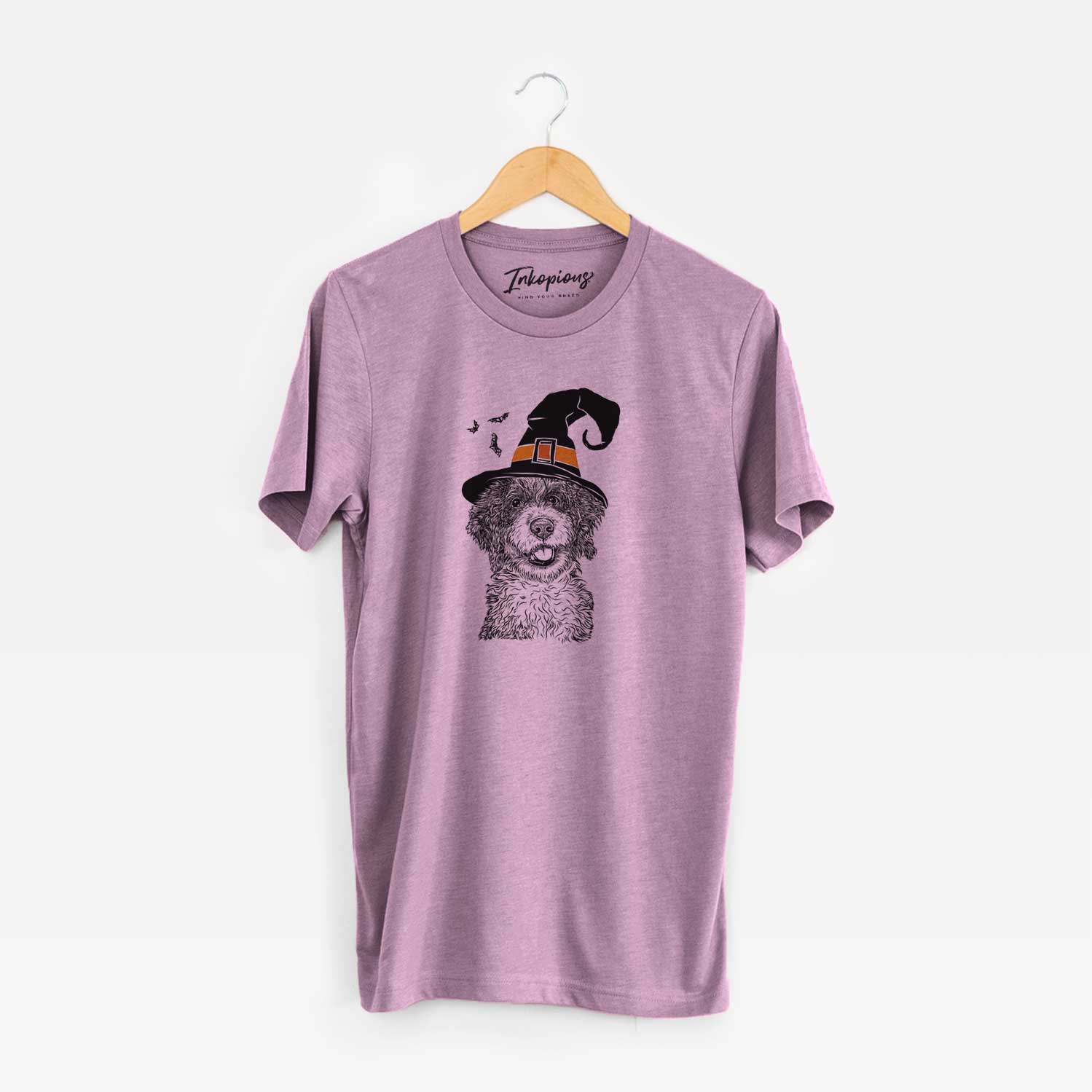 Hand-drawn sketch of Smoky the Bernedoodle Puppy wearing a witch hat on an Orchid Unisex crewneck