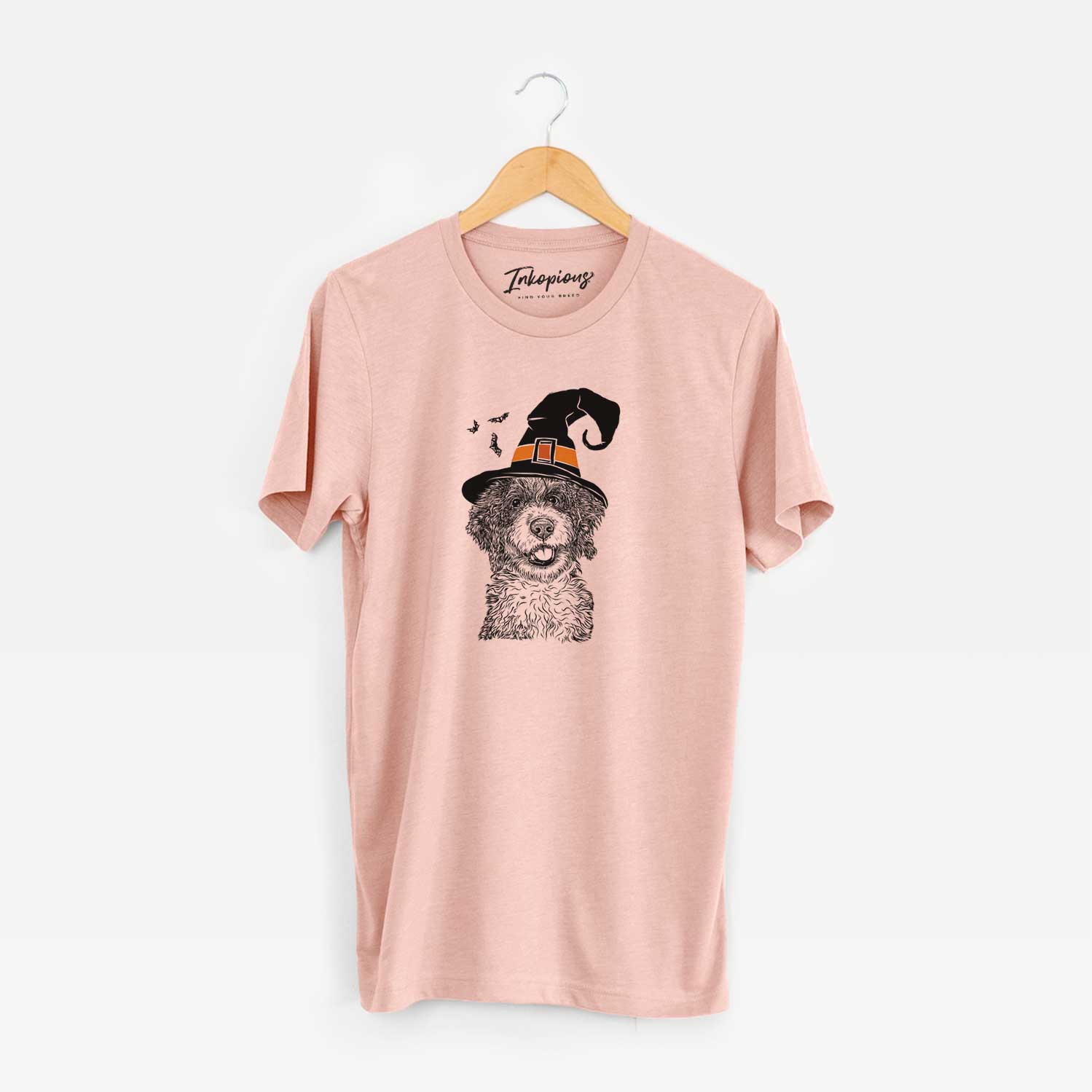 Hand-drawn sketch of Smoky the Bernedoodle Puppy wearing a witch hat on a Peach Unisex crewneck