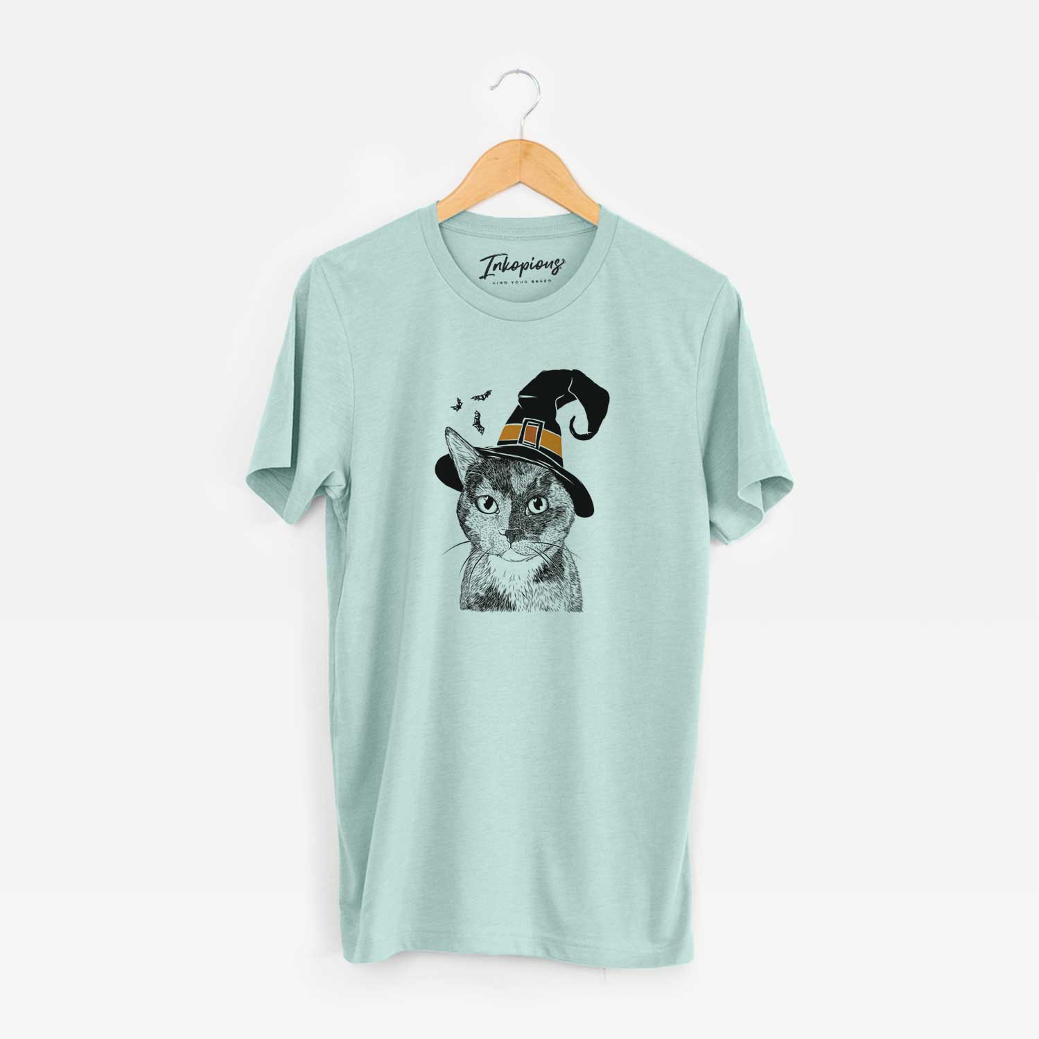 Hand-drawn sketch of Spooky Kitty the Tortoiseshell Cat wearing a witch hat on a Heather Sage Unisex crewneck