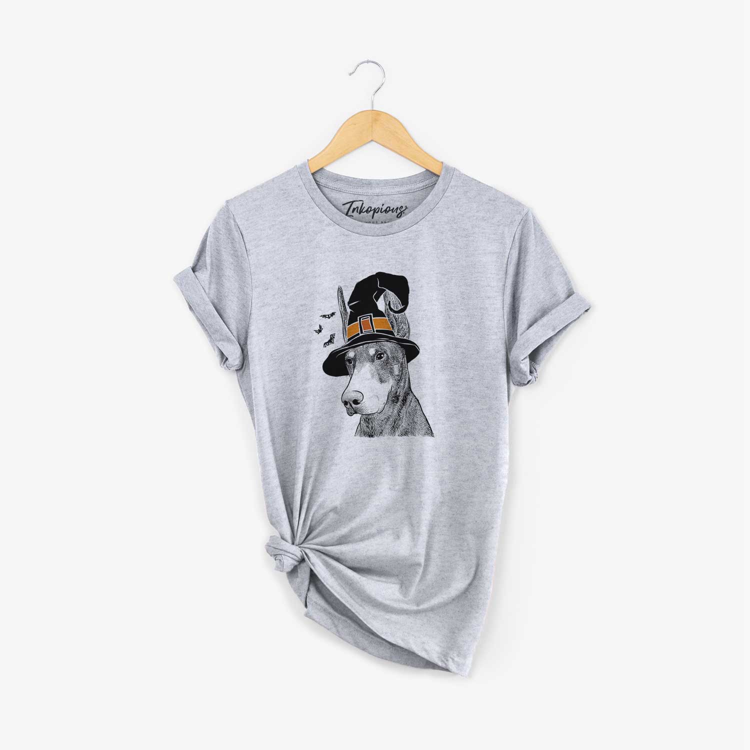 Hand-drawn sketch of Sunny the Doberman Pinscher wearing a witch hat on a Grey Unisex crewneck