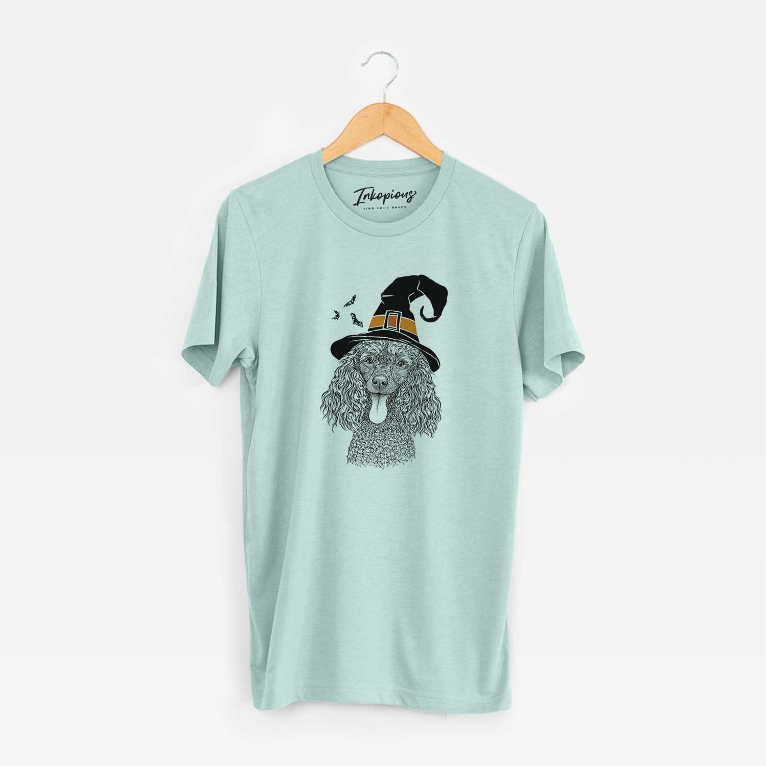 Hand-drawn sketch of Teddy the Mini Poodle wearing a witch hat on a Heather Sage Unisex crewneck