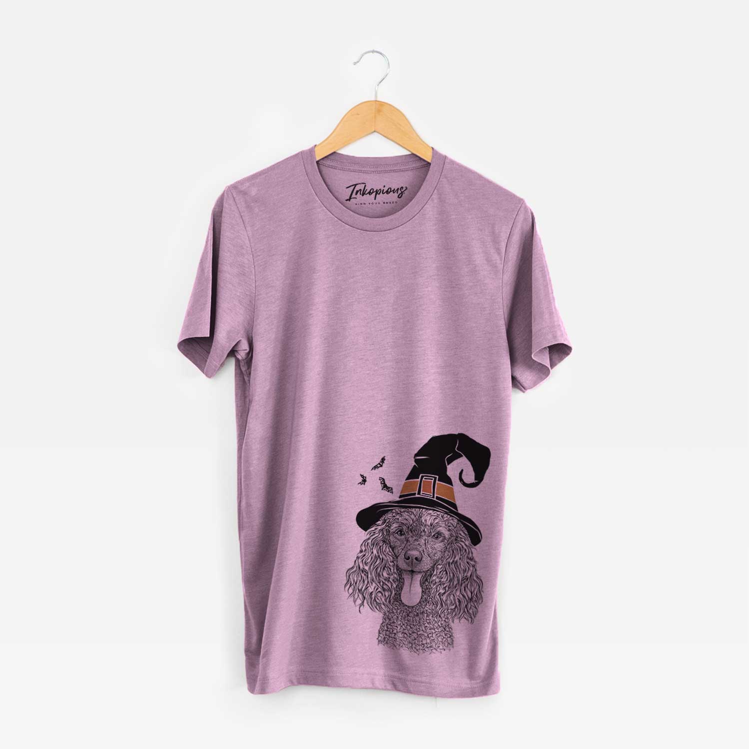 Hand-drawn sketch of Teddy the Mini Poodle wearing a witch hat on an Orchid Unisex crewneck