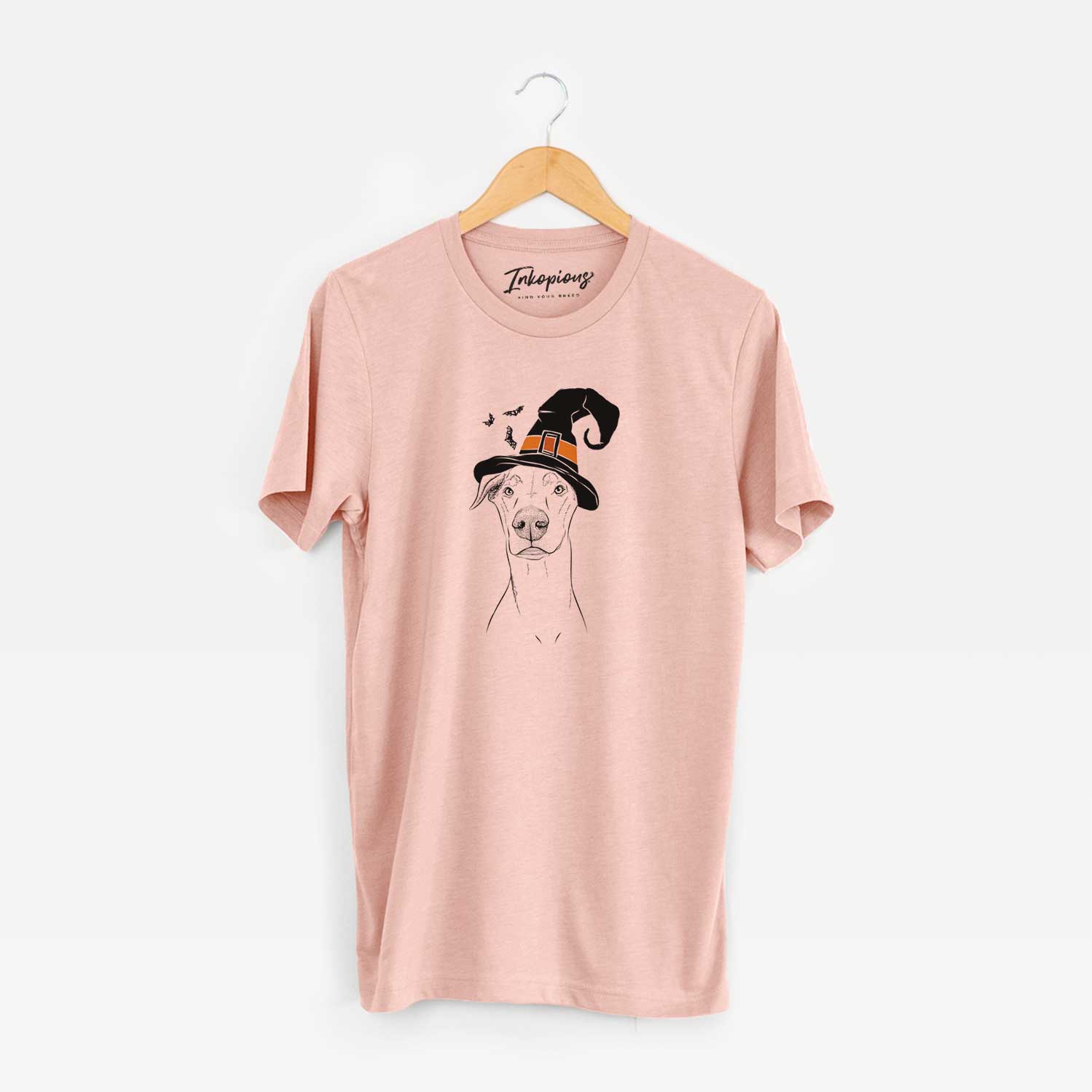 Hand-drawn sketch of Walter the White Doberman Rescue wearing a witch hat on a Peach Unisex crewneck