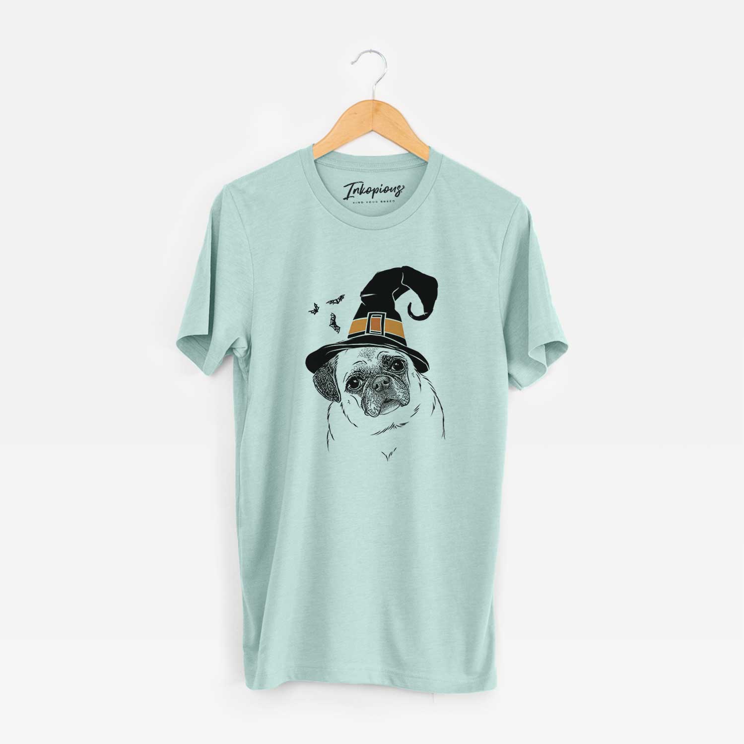 Hand-drawn sketch of Zoey the Pug wearing a witch hat on a Heather Sage Unisex crewneck