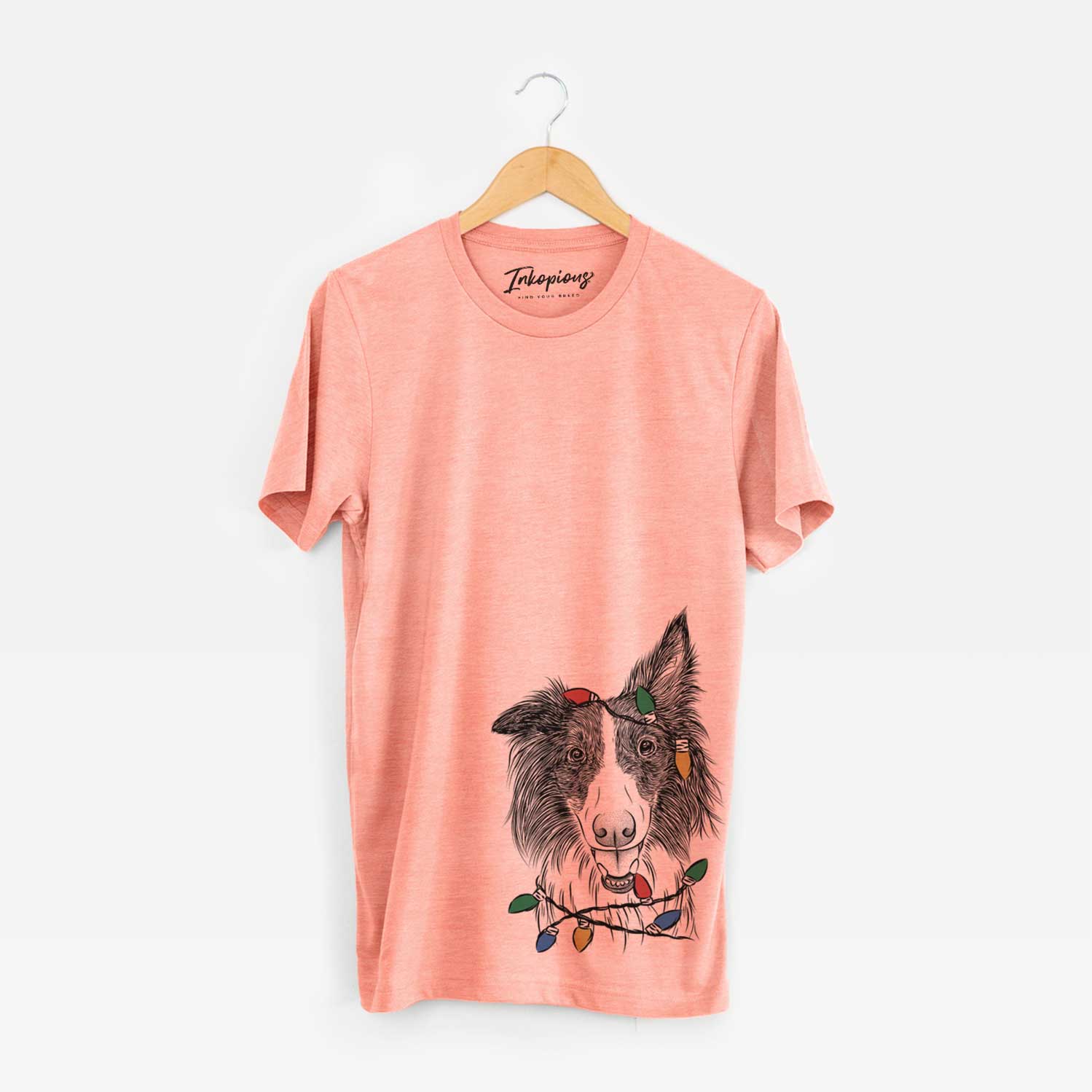 Hand-drawn sketch of Archie the Silken Windhound wrapped in Christmas lights on a Sunset Unisex crewneck