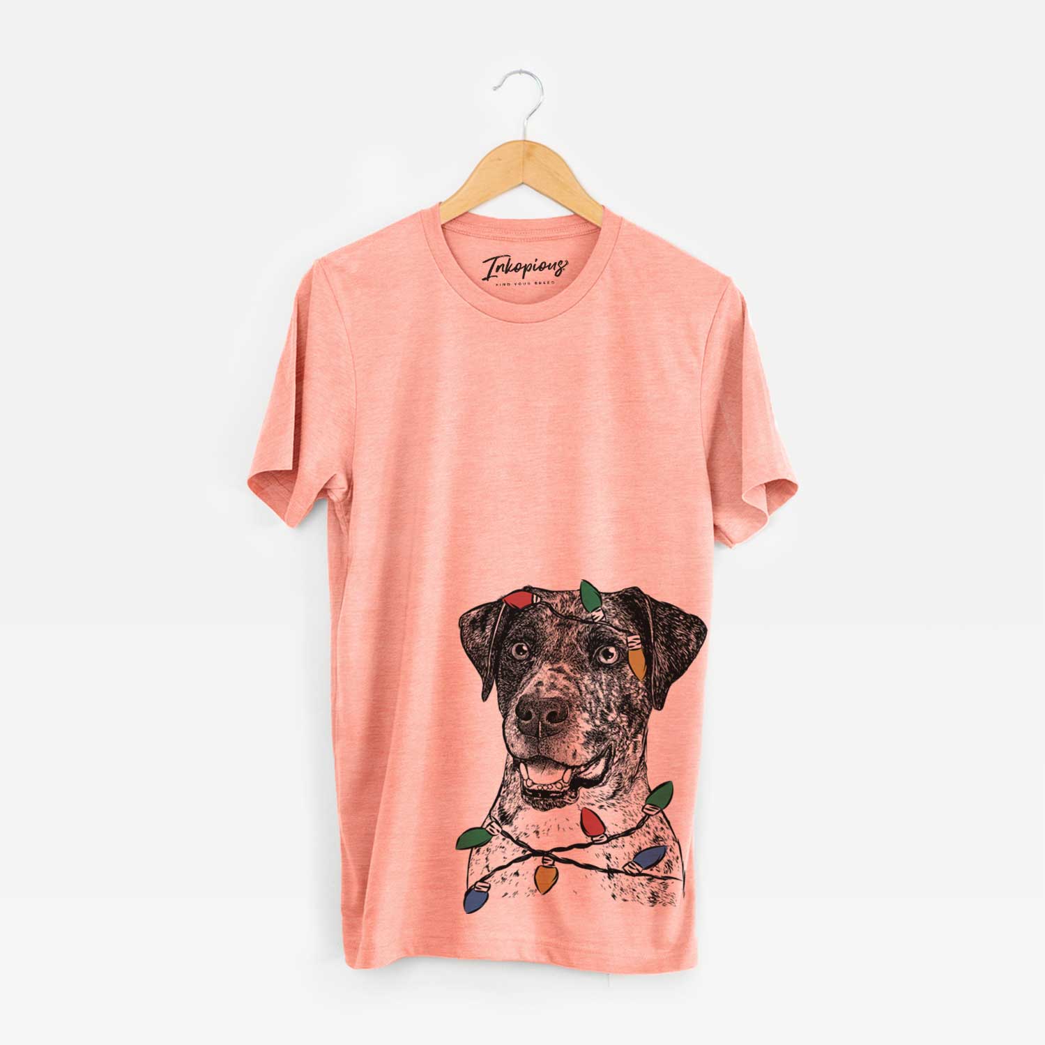 Hand-drawn sketch of Argos the Catahoula wrapped in Christmas lights on a Sunset Unisex crewneck