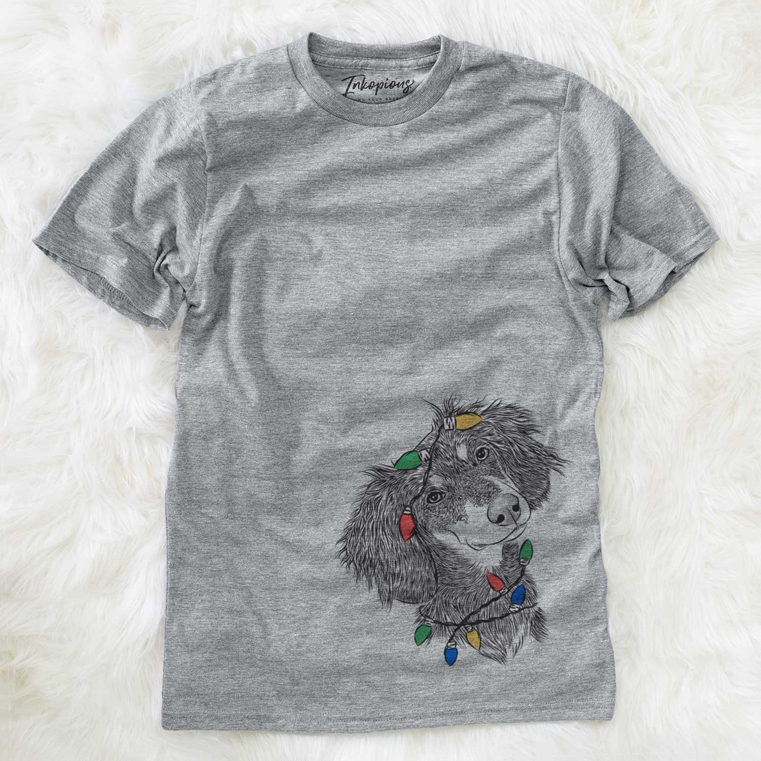 Hand-drawn sketch of Bailey the Long Haired Dachshund wrapped in Christmas lights on a Grey Unisex crewneck
