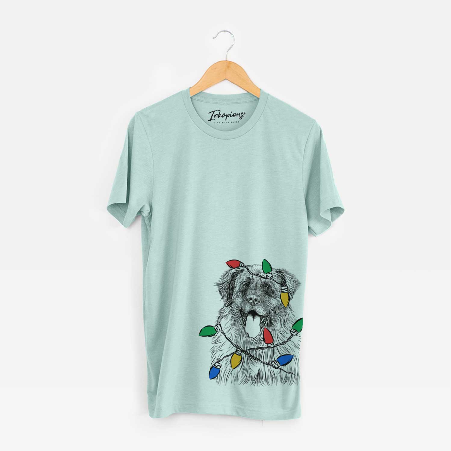 Hand-drawn sketch of Bamboo the Leonberger wrapped in Christmas lights on a Heather Sage Unisex crewneck
