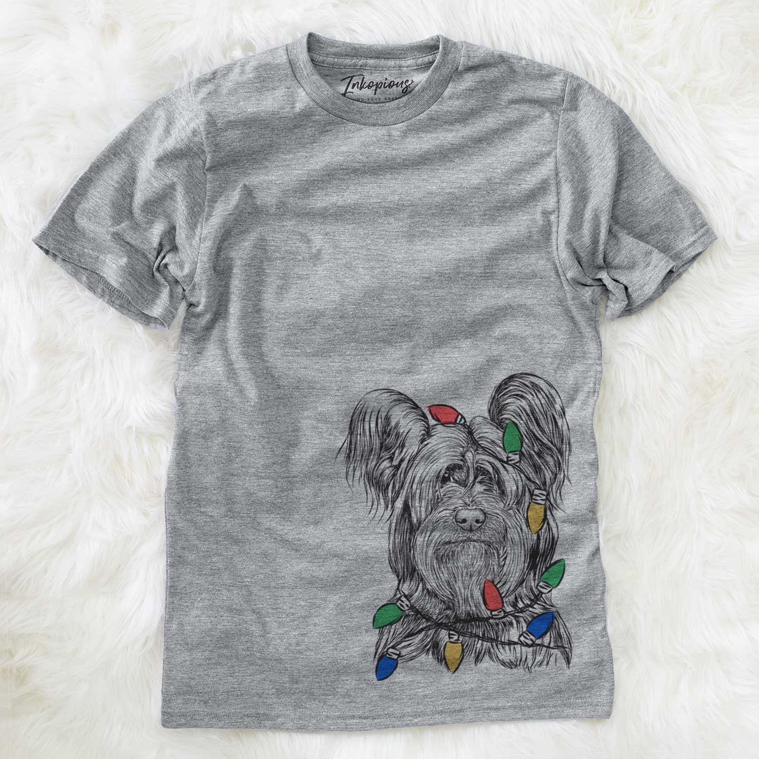 Hand-drawn sketch of Bandit the Skye Terrier wrapped in Christmas lights on a Grey Unisex crewneck