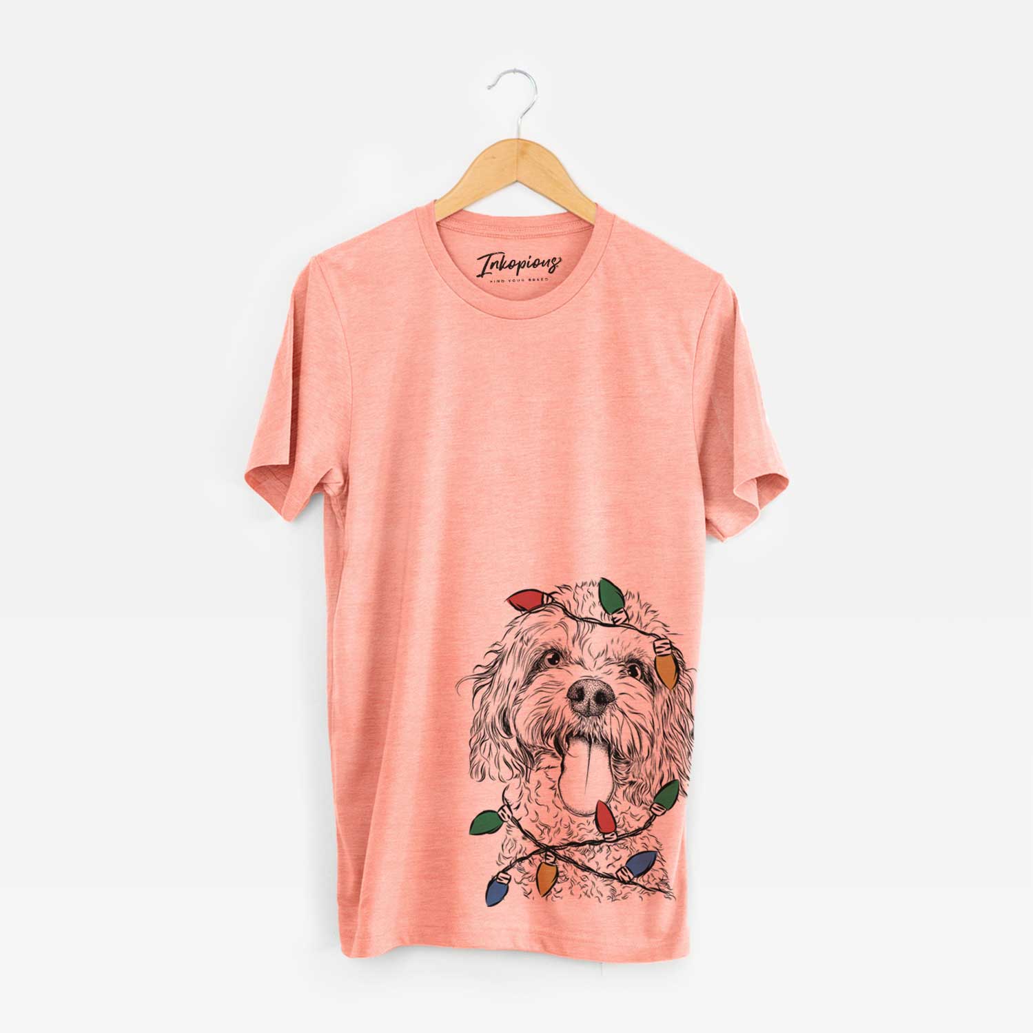 Hand-drawn sketch of Barney the Cavachon wrapped in Christmas lights on a Sunset Unisex crewneck