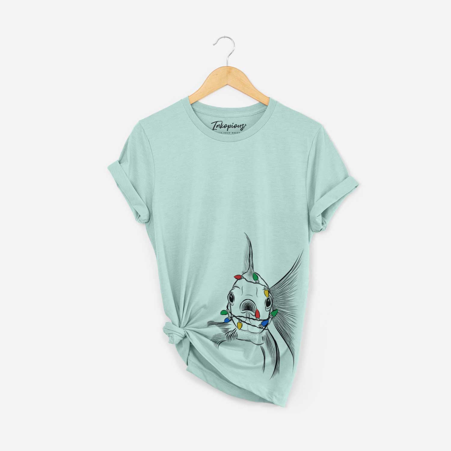 Hand-drawn sketch of Beefcake the Goldfish wrapped in Christmas lights on a Heather Sage Unisex crewneck