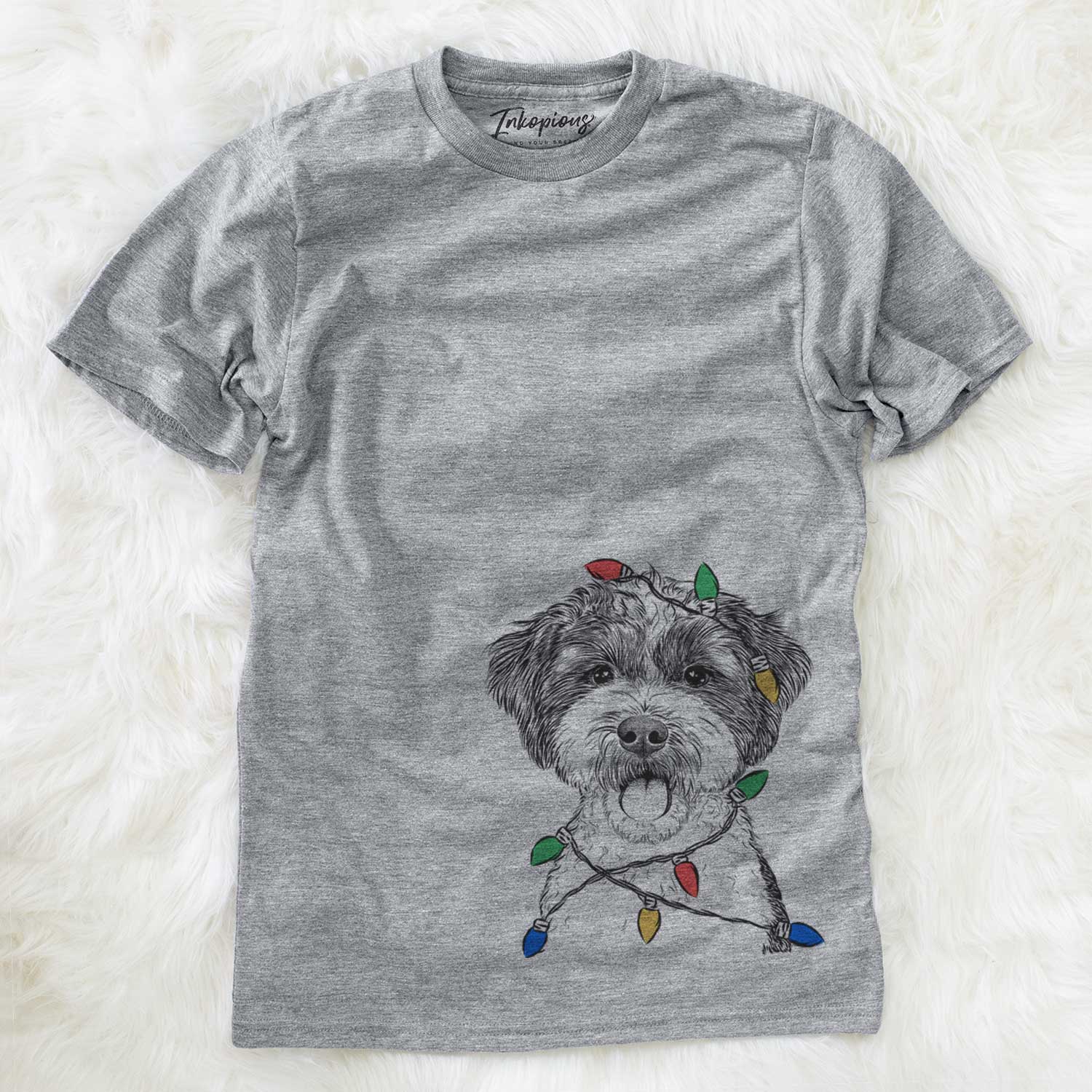 Hand-drawn sketch of Bella the Cockapoo wrapped in Christmas lights on a Grey Unisex crewneck