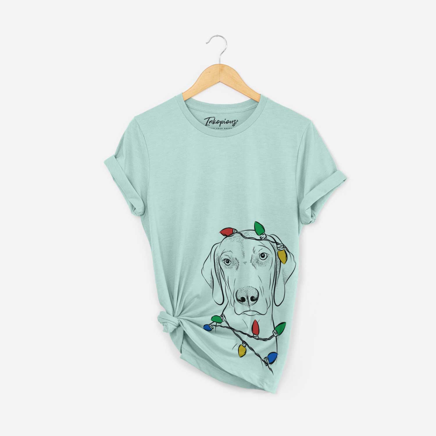 Hand-drawn sketch of Benelli the Vizsla wrapped in Christmas lights on a Heather Sage Unisex crewneck