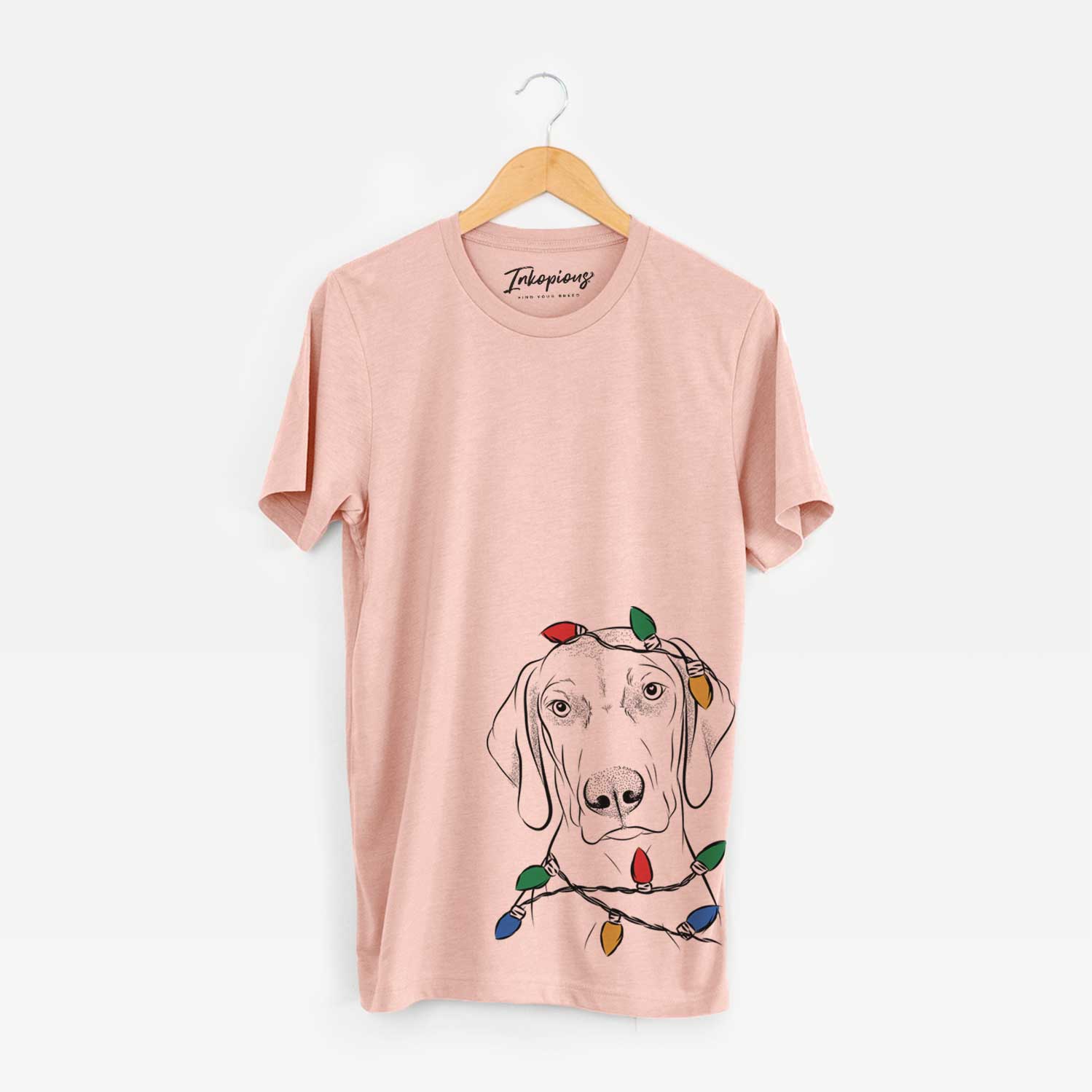 Hand-drawn sketch of Benelli the Vizsla wrapped in Christmas lights on a Peach Unisex crewneck