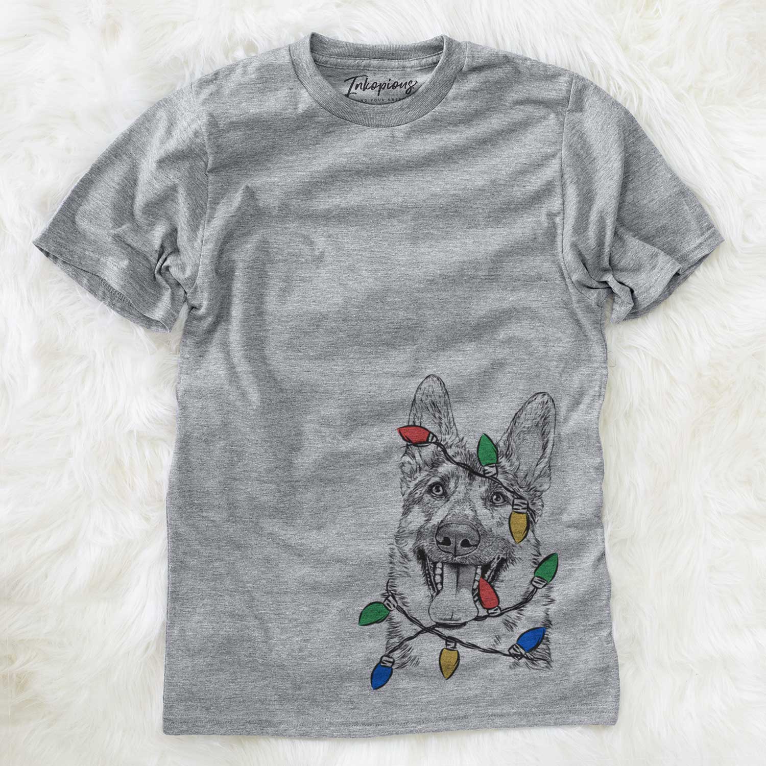 Hand-drawn sketch of Benson the German Shepherd wrapped in Christmas lights on a Grey Unisex crewneck