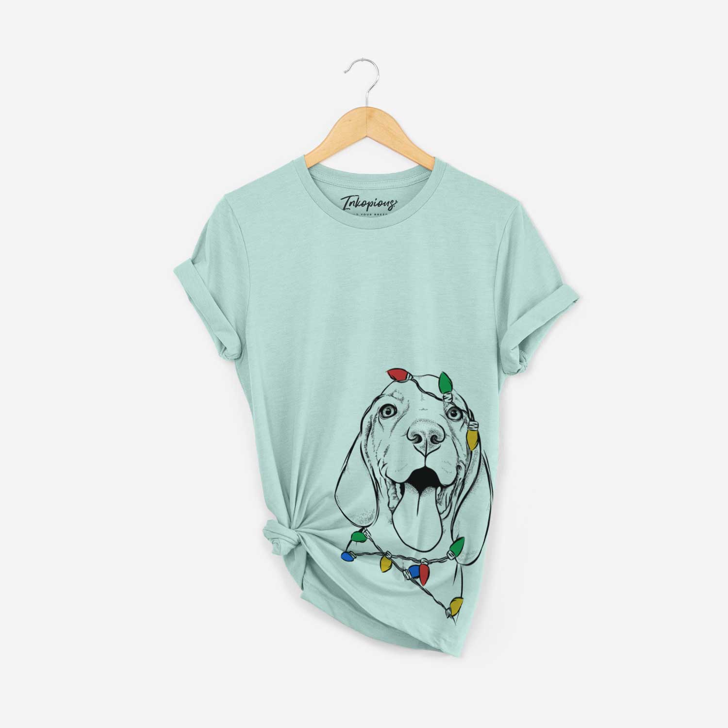 Hand-drawn sketch of Bodi the Vizsla wrapped in Christmas lights on a Heather Sage Unisex crewneck