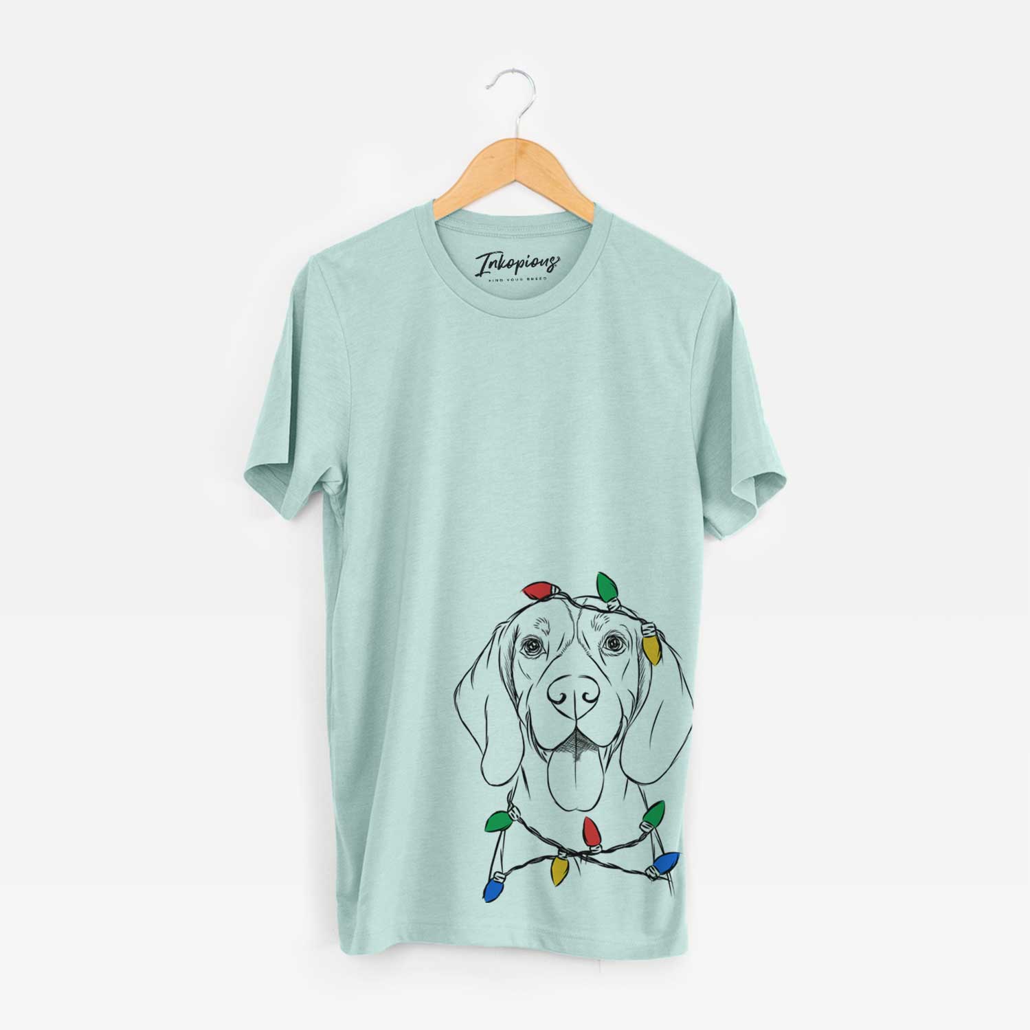 Hand-drawn sketch of Bogie the Beagle wrapped in Christmas lights on a Heather Sage Unisex crewneck