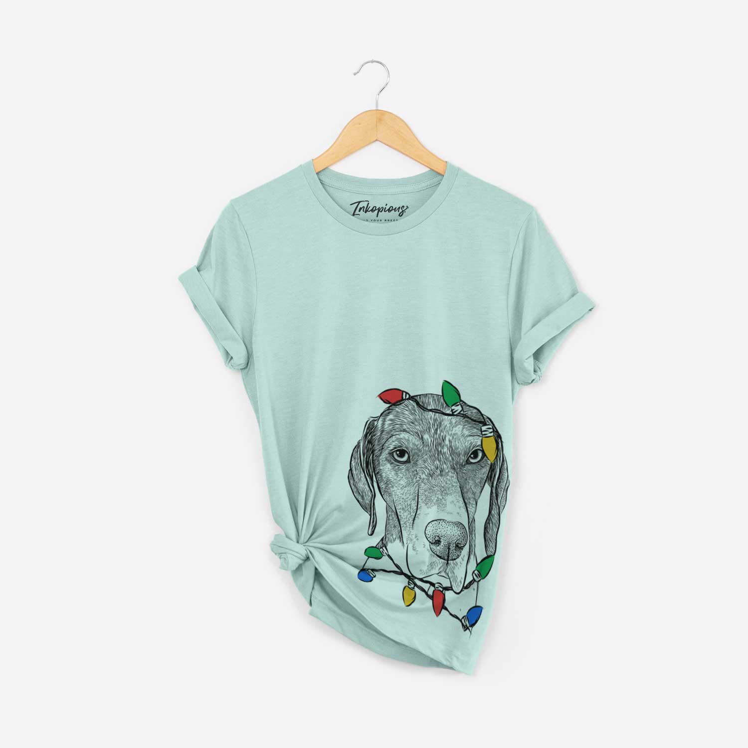 Hand-drawn sketch of Bohdi the German Shorthaired Pointer wrapped in Christmas lights on a Heather Sage Unisex crewneck