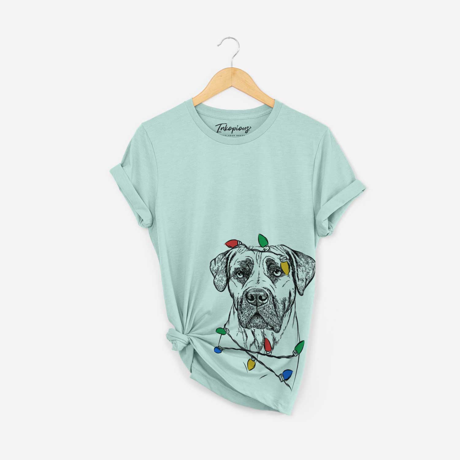 Hand-drawn sketch of Boris the Boerboel wrapped in Christmas lights on a Heather Sage Unisex crewneck