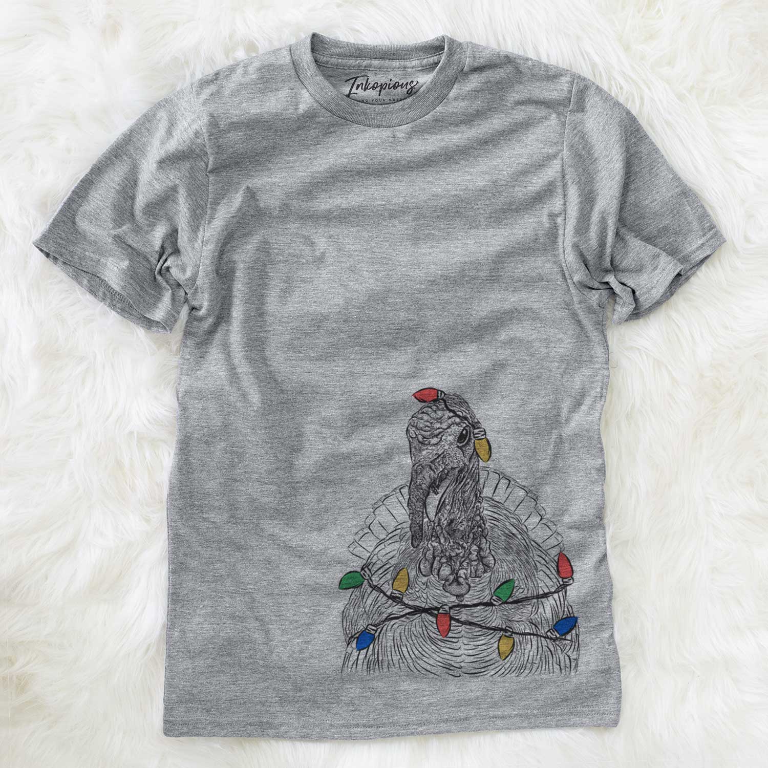 Hand-drawn sketch of Brady the Turkey wrapped in Christmas lights on a Grey Unisex crewneck