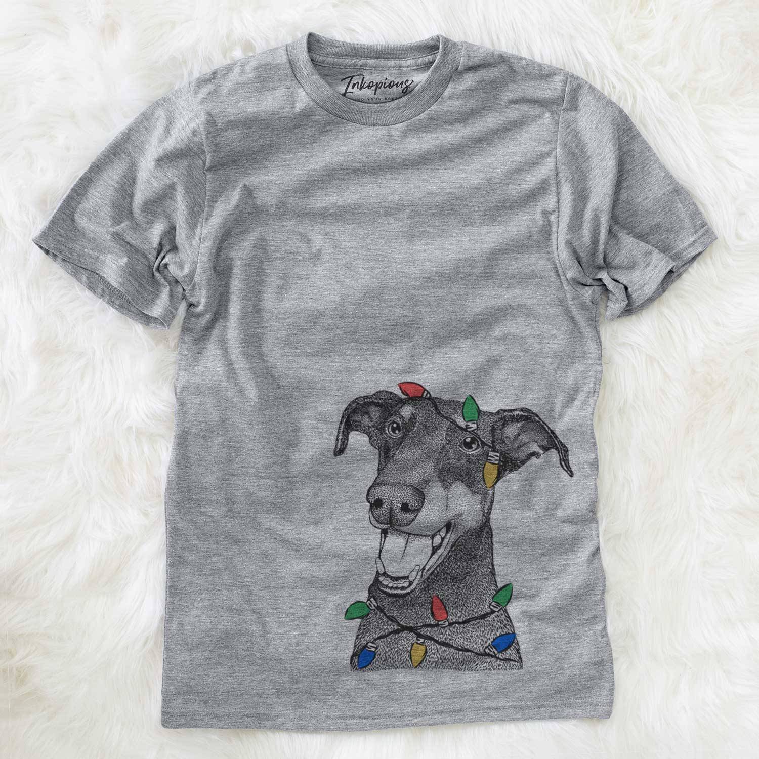 Hand-drawn sketch of Bunnie the Doberman Pinscher wrapped in Christmas lights on a Grey Unisex crewneck