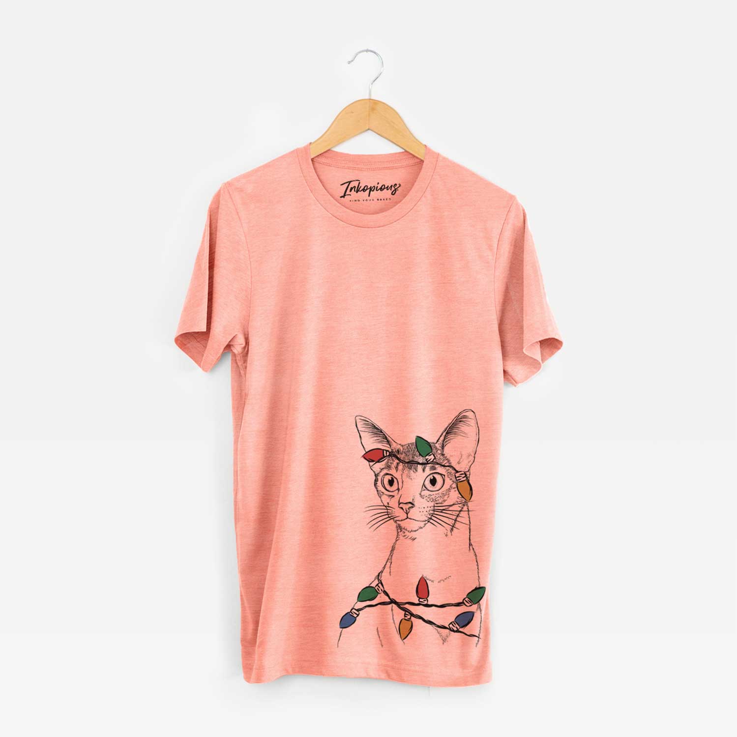 Hand-drawn sketch of Cedric the Abyssinian Cat wrapped in Christmas lights on a Sunset Unisex crewneck
