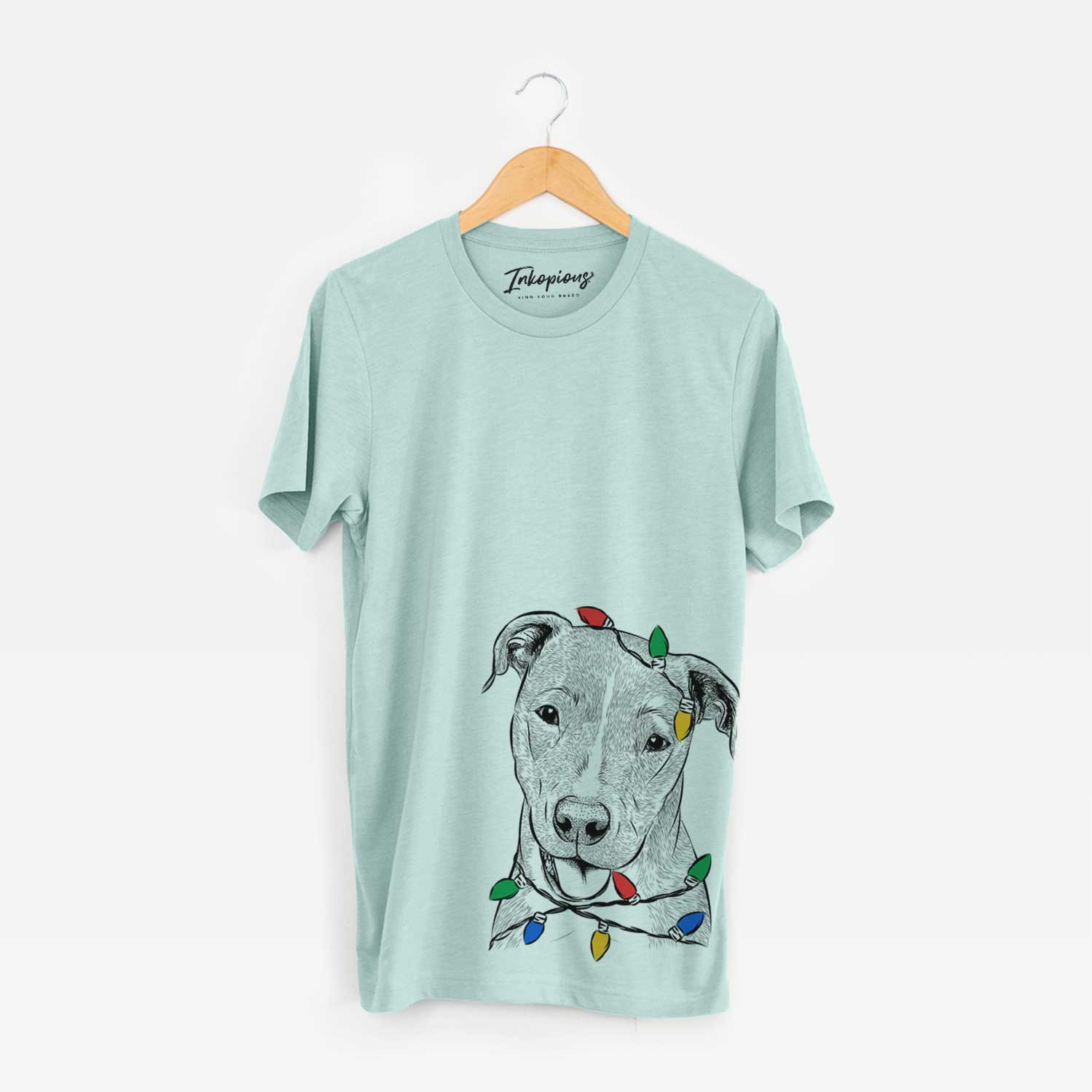 Hand-drawn sketch of Claiborne the American Staffordshire Terrier wrapped in Christmas lights on a Heather Sage Unisex crewneck