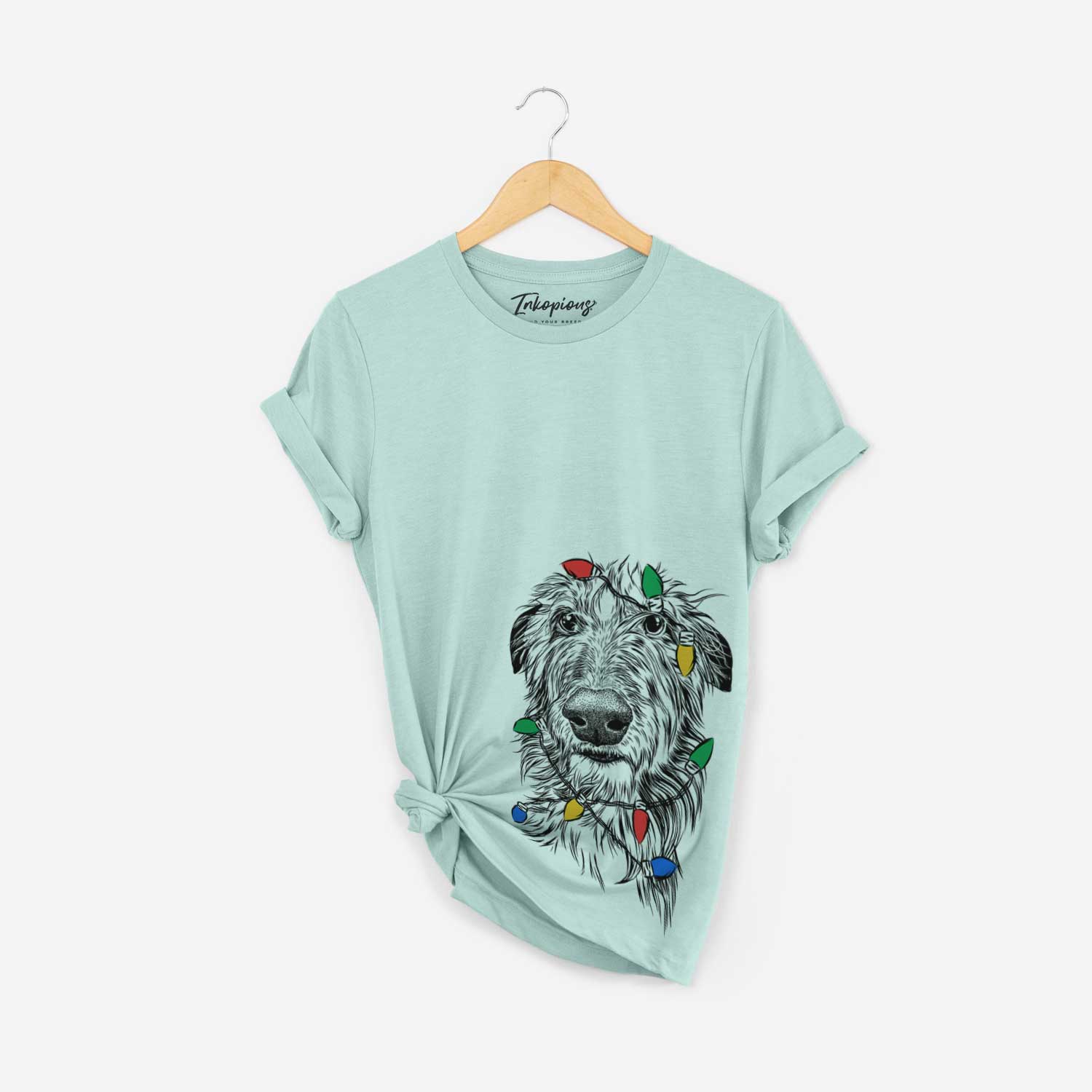 Hand-drawn sketch of Cleod the Scottish Deerhound wrapped in Christmas lights on a Heather Sage Unisex crewneck