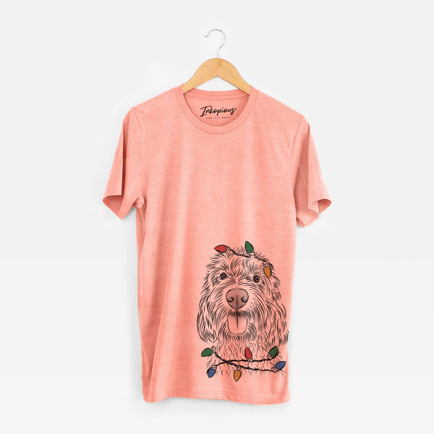 Hand-drawn sketch of Clover the Cockapoo wrapped in Christmas lights on a Sunset Unisex crewneck