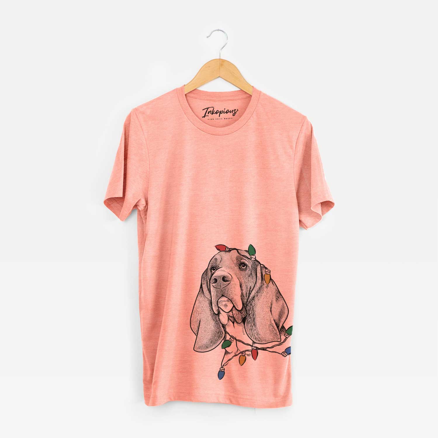 Hand-drawn sketch of Cooper the Basset Hound wrapped in Christmas lights on a Sunset Unisex crewneck