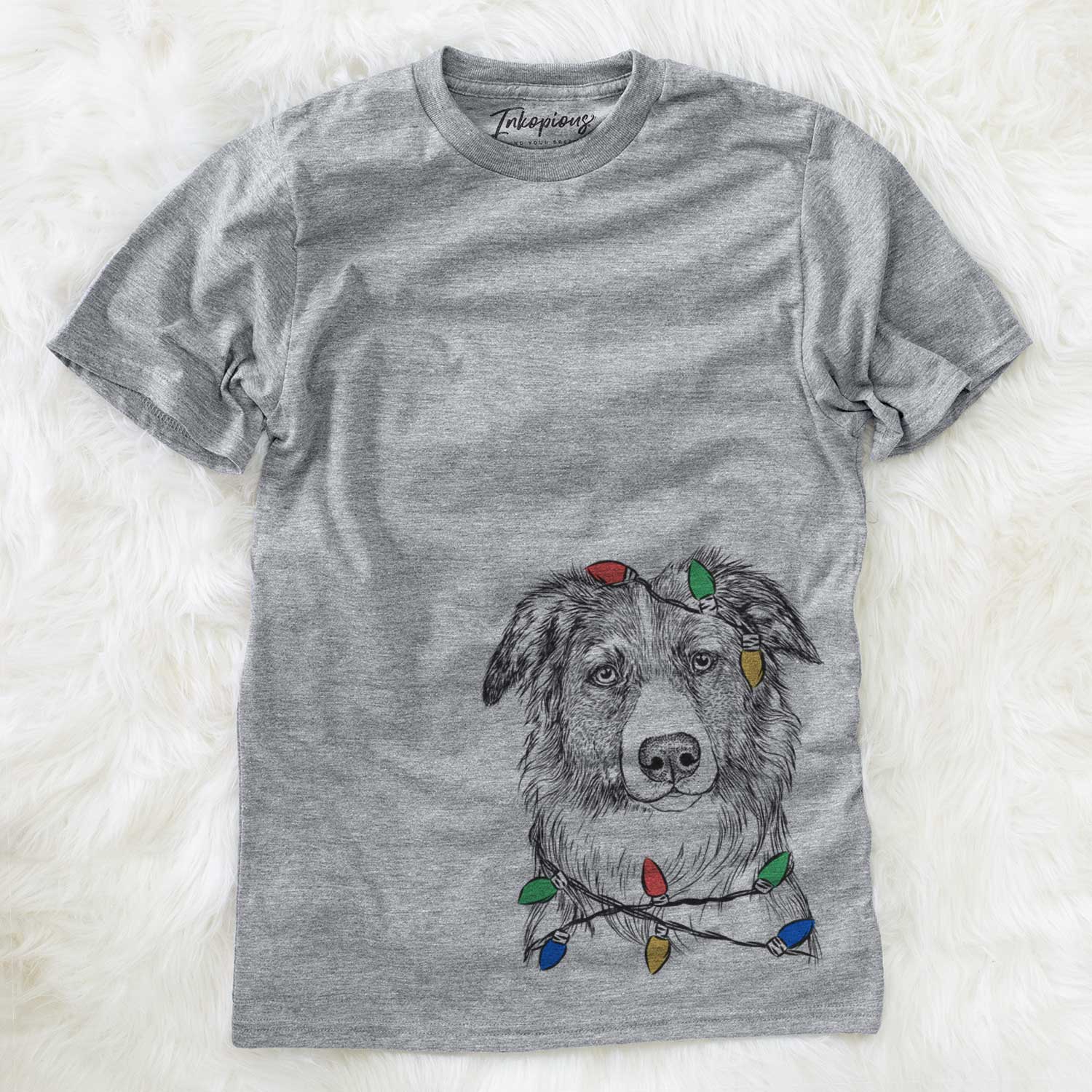 Hand-drawn sketch of Cynder the English Shepherd wrapped in Christmas lights on a Grey Unisex crewneck