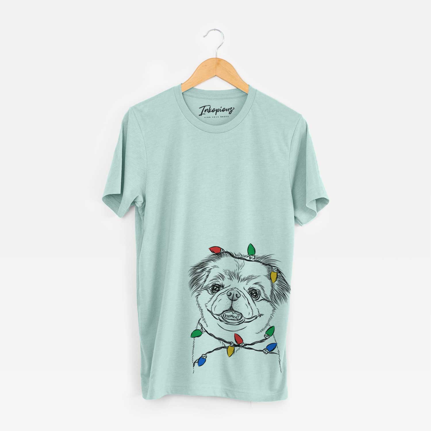 Hand-drawn sketch of Danny the Pekingese wrapped in Christmas lights on a Heather Sage Unisex crewneck