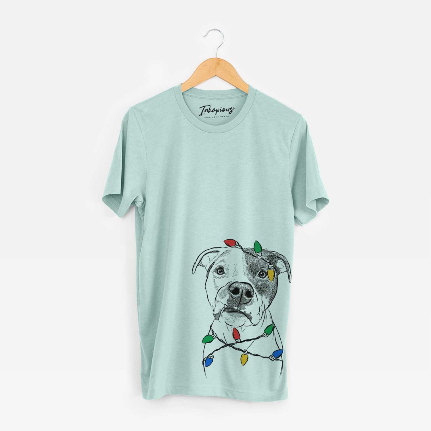 Hand-drawn sketch of Dexter the Pitbull wrapped in Christmas lights on a Heather Sage Unisex crewneck