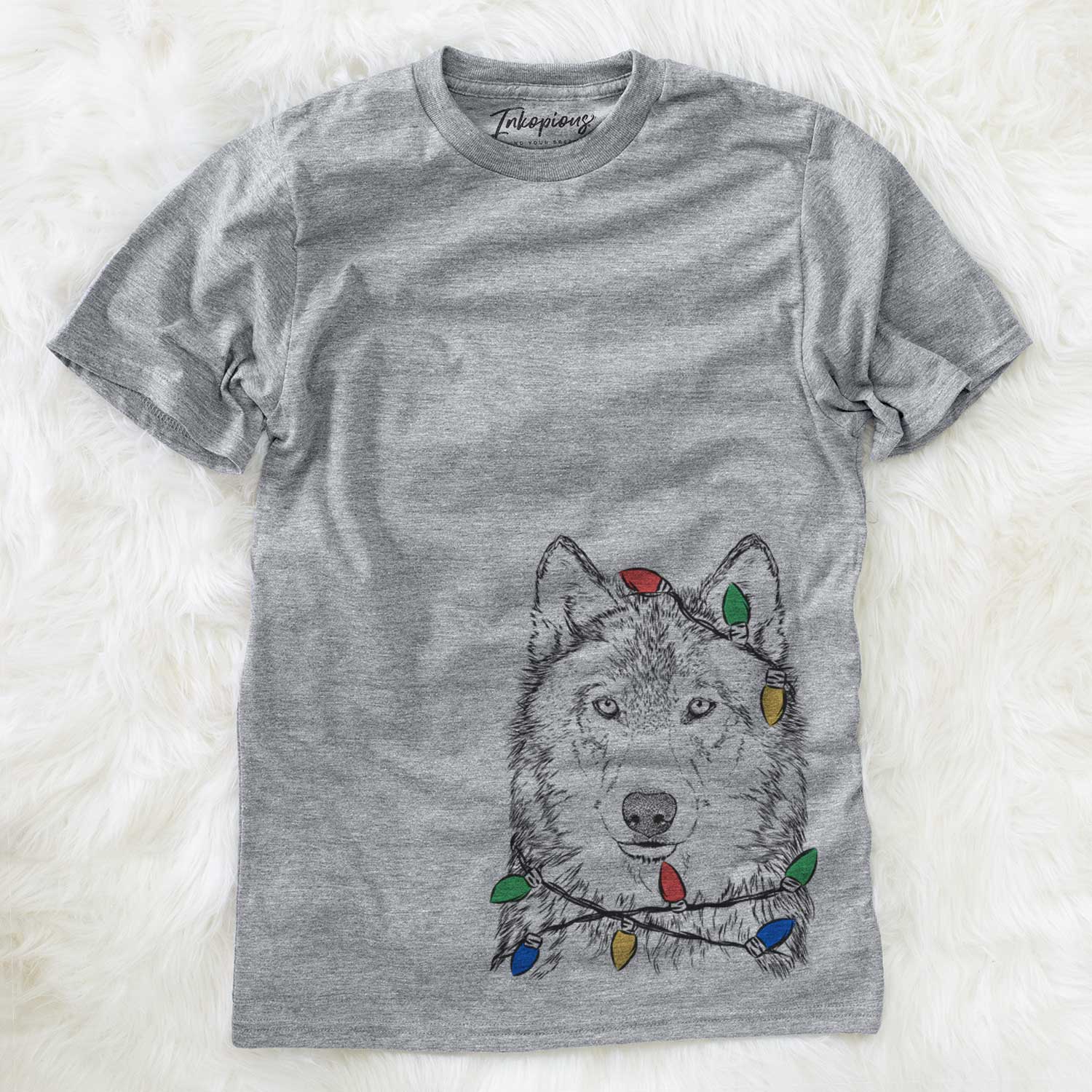 Hand-drawn sketch of Django the Grey Wolf wrapped in Christmas lights on an Unisex crewneck