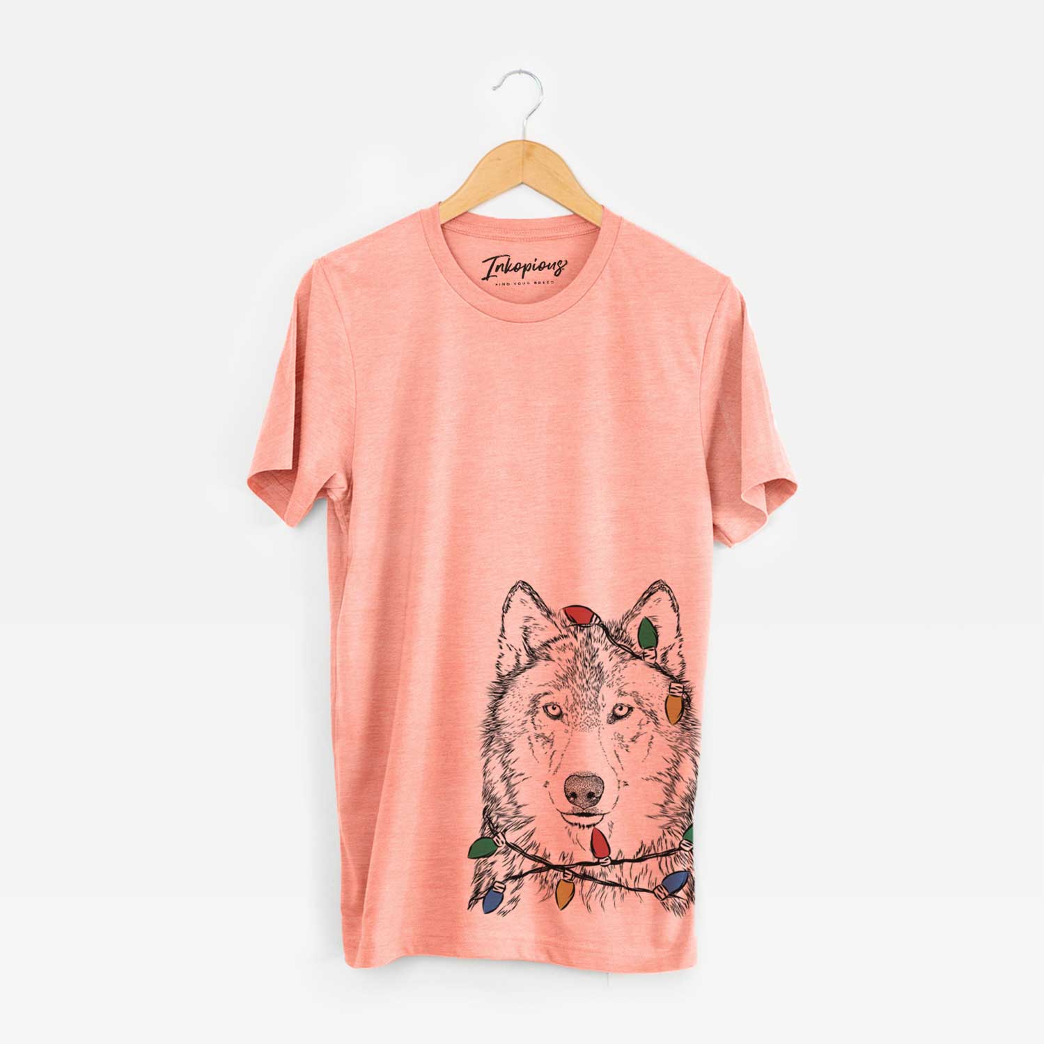 Hand-drawn sketch of Django the Grey Wolf wrapped in Christmas lights on a Sunset Unisex crewneck