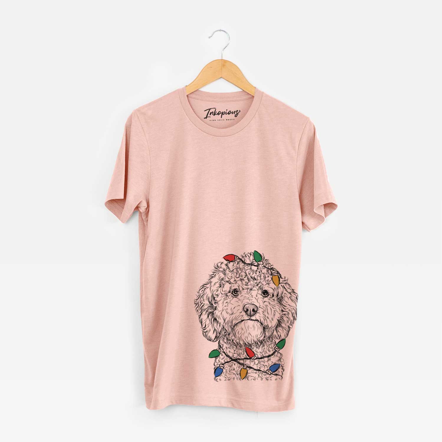 Hand-drawn sketch of Edgar the Shihpoo wrapped in Christmas lights on a Peach Unisex crewneck