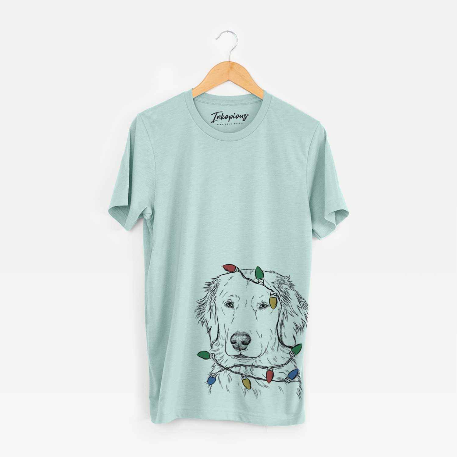 Hand-drawn sketch of Eli the Golden Retriever wrapped in Christmas lights on a Heather Sage Unisex crewneck