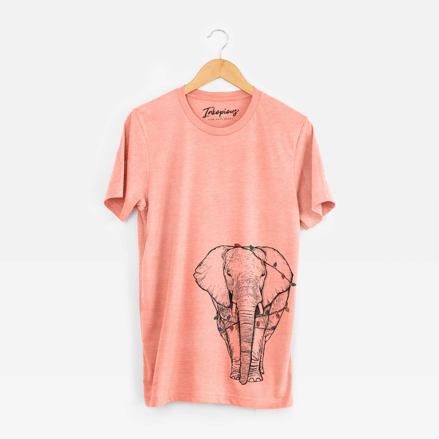 Hand-drawn sketch of Ella the Elephant wrapped in Christmas lights on a Sunset Unisex crewneck